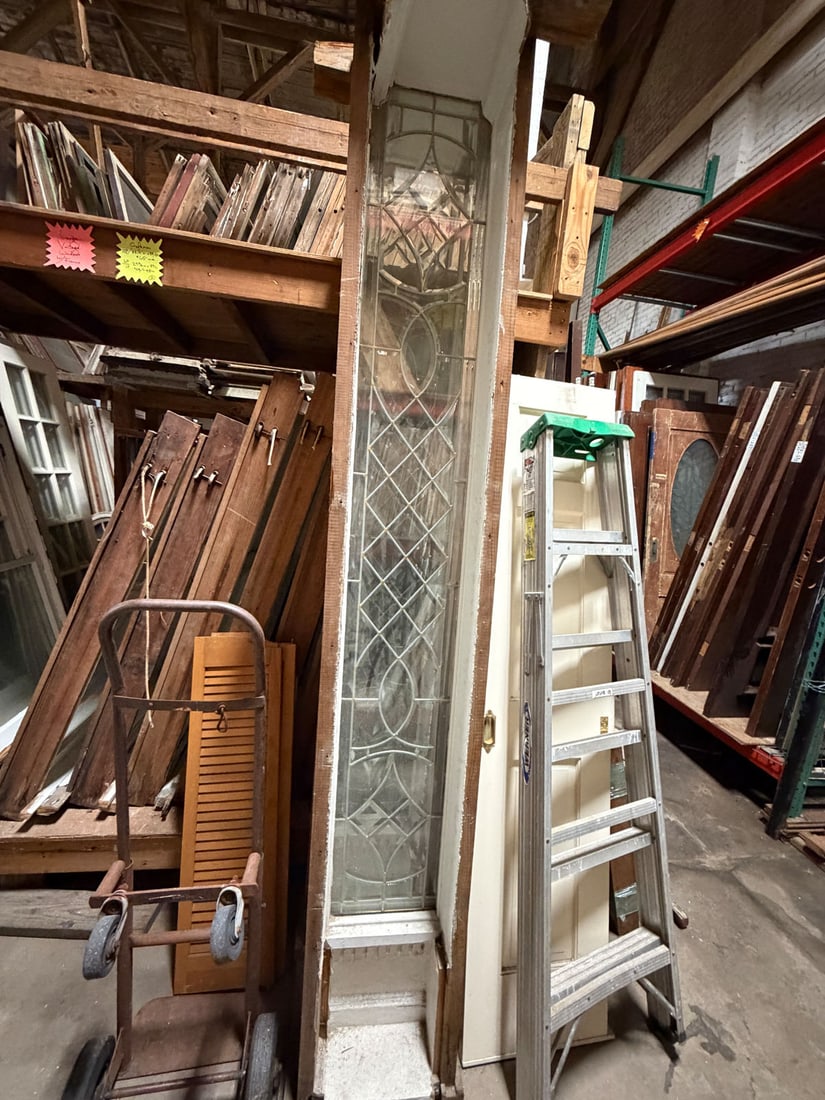 Reclaimed vintage pair of beveled and leaded glass entry sidelights: Reclaimed vintage pair of beveled and leaded glass sidelights in frames.Measurements: 15" x 103