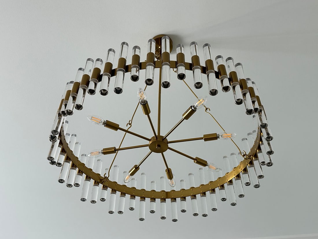 Haskell 43" Brass and Acrylic Oval Chandelier: Haskell antique brass and acrylic oval chandelier. Installed and then removed. Like new. Already crated. Measurements: 43" x 16.5" x 27"