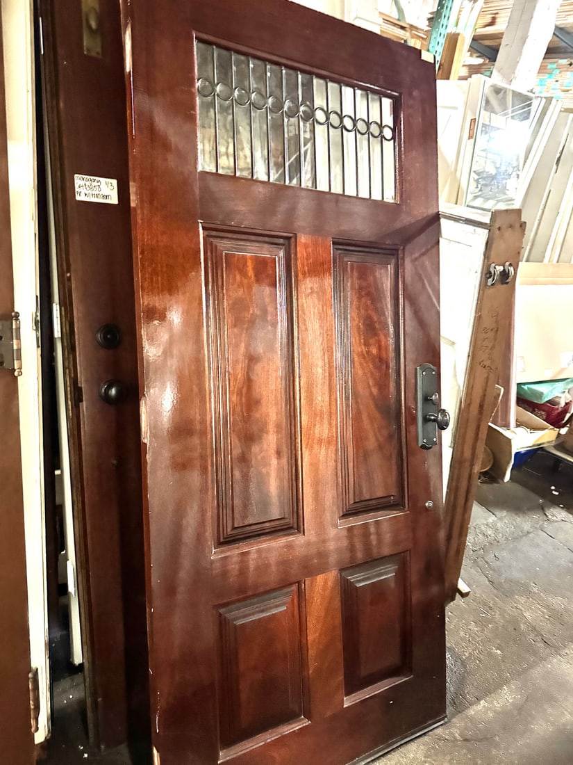 Reclaimed solid mahogany entry door with leaded and beveled glass upper: This is my all time "favorite" door. Solid mahogany entry door with upper leaded and beveled glass. The circular detailing with beveled glass is stunning! Measurement: 36" x 80"