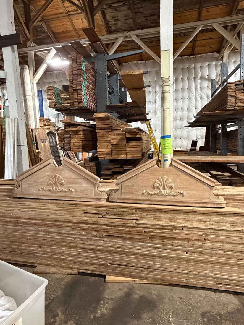 Reclaimed pair of monumental door headers: Reclaimed pair of monumental door headers with broken pedimented top.Measurements: