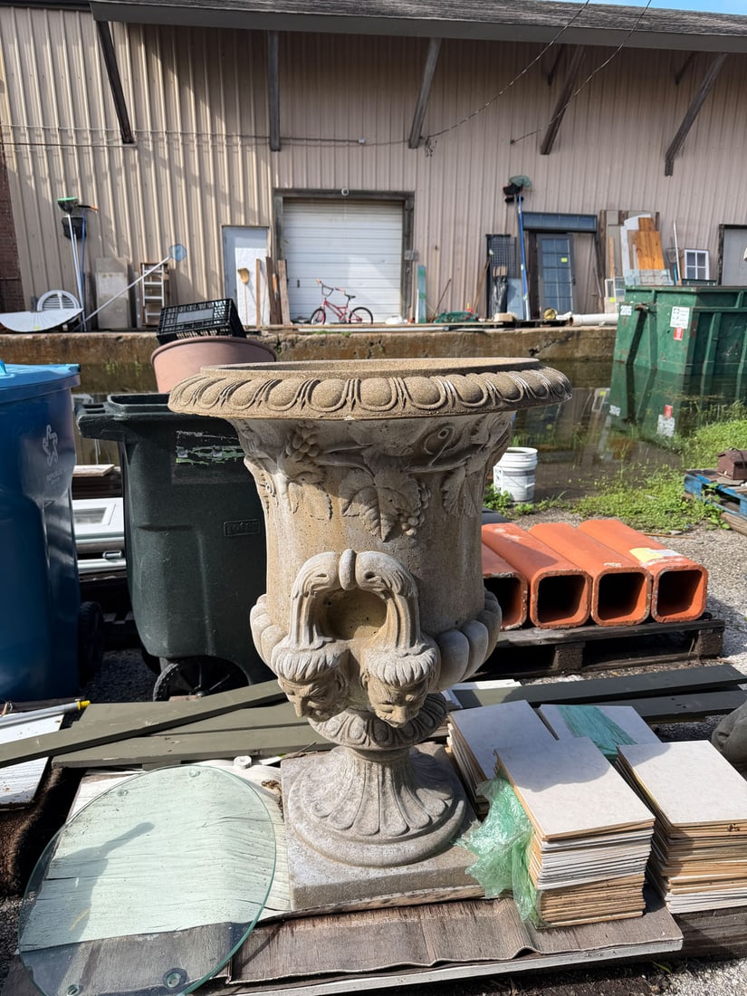 Reclaimed cast concrete urn fountain: Reclaimed substantial cast stone garden urn fountain featuring richly sculptured neoclassical ornamentation. The large campana-form, bowl is decorated with deeply molded grape clusters, vine leaves an