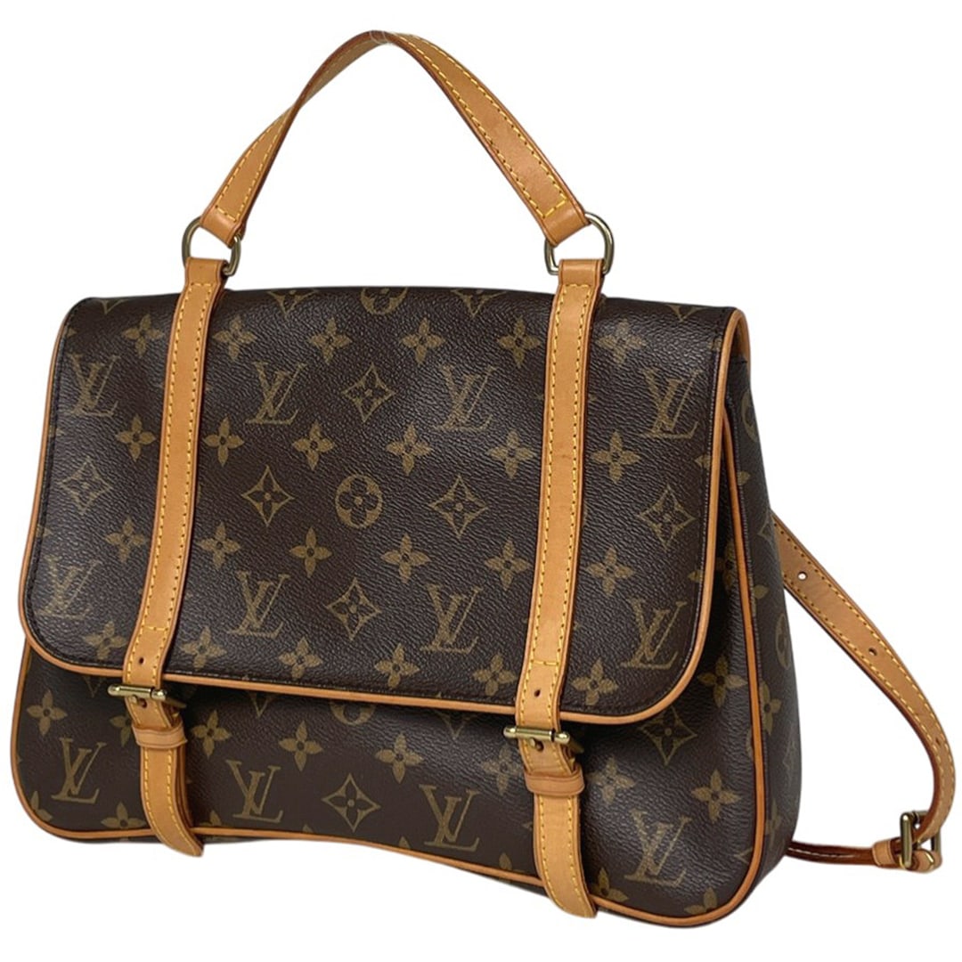 Louis Vuitton Marelle: Brand : Louis VuittonModel : Marelle Sac Ado — Réf. M51158Material : Toile Monogram, garnitures en cuir VachettaColor : BrownDimensions : L. 30 cm × H. 20 cm × P. 6 cmCondition : Very good condit