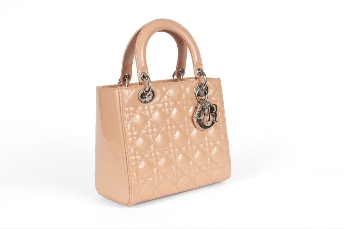 DIOR: DIOR, Lady modelDimensions 24*21*11 cmColor: Powder pink, nude patent leatherSilver hardwareCirca 2000Very lightly worn, in excellent conditionSold with its original pouch.