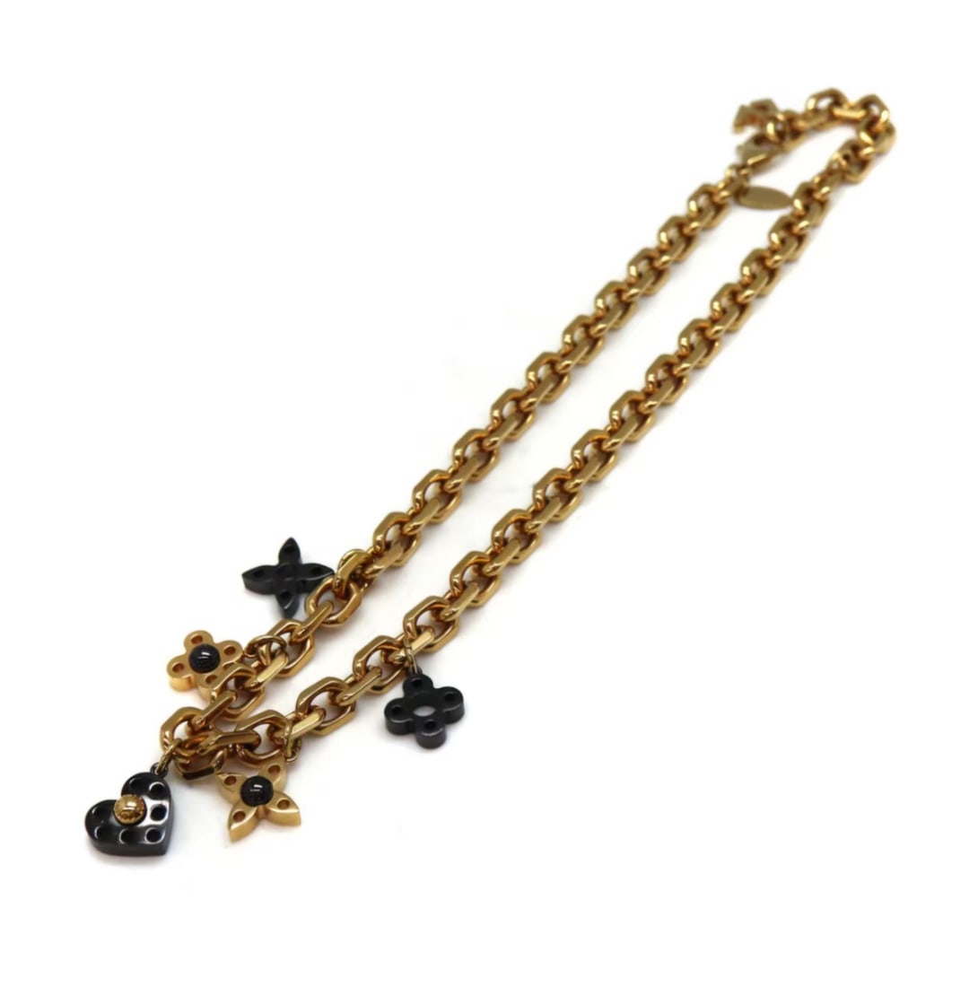 LOUIS VUITTON Collier Hide and Seek Gold Black Necklace: Item Name:Louis Vuitton Collier Hide and Seek Gold Black Necklace Brand:Louis Vuitton Model No.:M65236 LE 0163 Sizs:46cm Material:Metal Color:Black/Gold Accessories:N/A