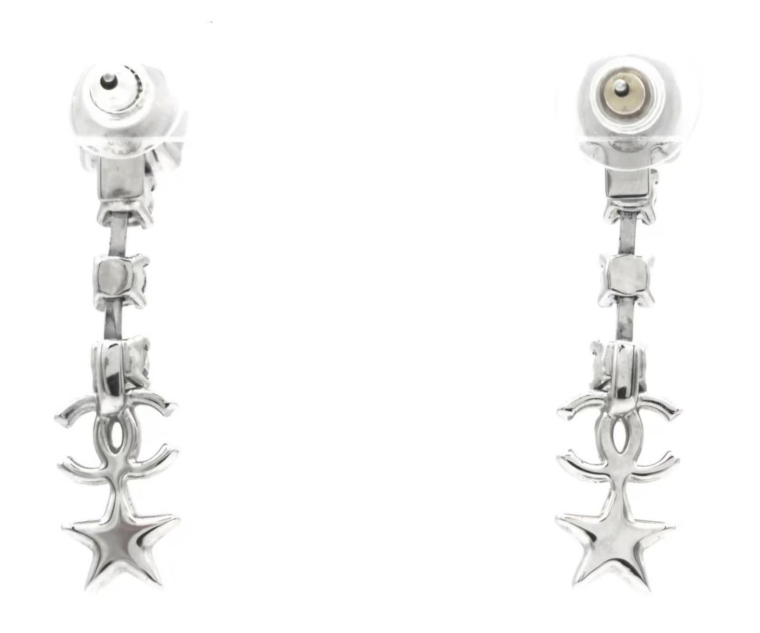 CHANEL Elegant Silver Star Drop Earrings: Item Name:Chanel CC Logo Dangly Earring Brand:Chanel Model No.:B20P 2020YR Sizs:N/A Material:Metal/Strass Accessories:Box