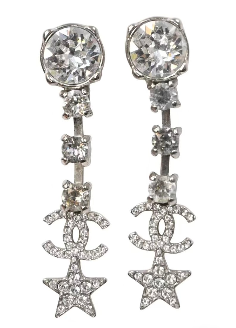CHANEL Elegant Silver Star Drop Earrings: Item Name:Chanel CC Logo Dangly Earring Brand:Chanel Model No.:B20P 2020YR Sizs:N/A Material:Metal/Strass Accessories:Box