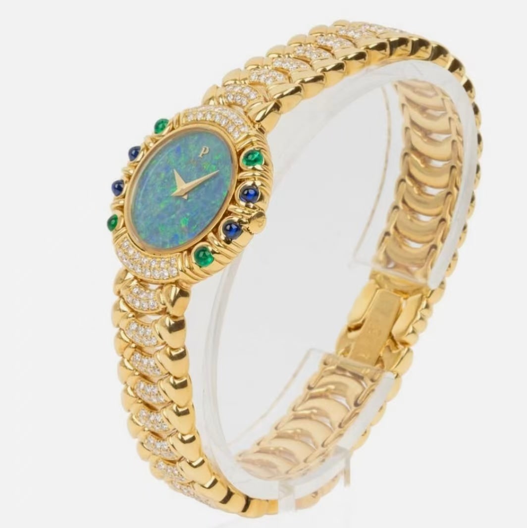 PIAGET Opal Dial 18K Daimond Ladies Watch: Type: Watch Model:N/A Case Material: 18K;Daimond;Opal;Gem Stone Movement: Quartz Band Material: 18K Dial Color: Yellow Gold Case Size: 24mm Wrist Size: 14cm Accessories:Repir Certificate