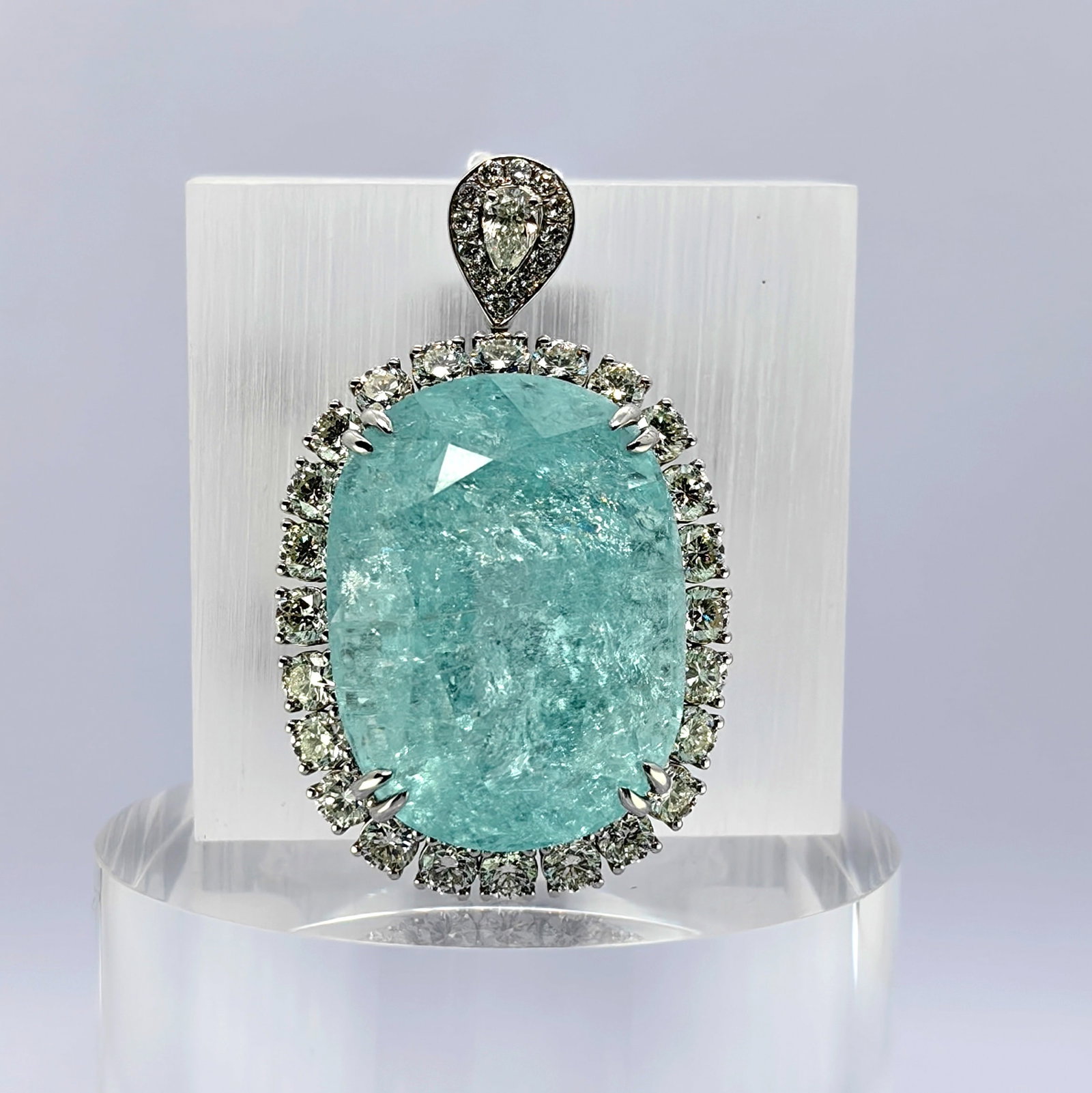 K18 Mozambique H Greenish Paraida Diamond Pendant: Type: Pendant Metal:K18 White Gold Paraida:60.87ct Diamond:3.78ct Size:N/A Signed By: N/A Additional Information: GRS