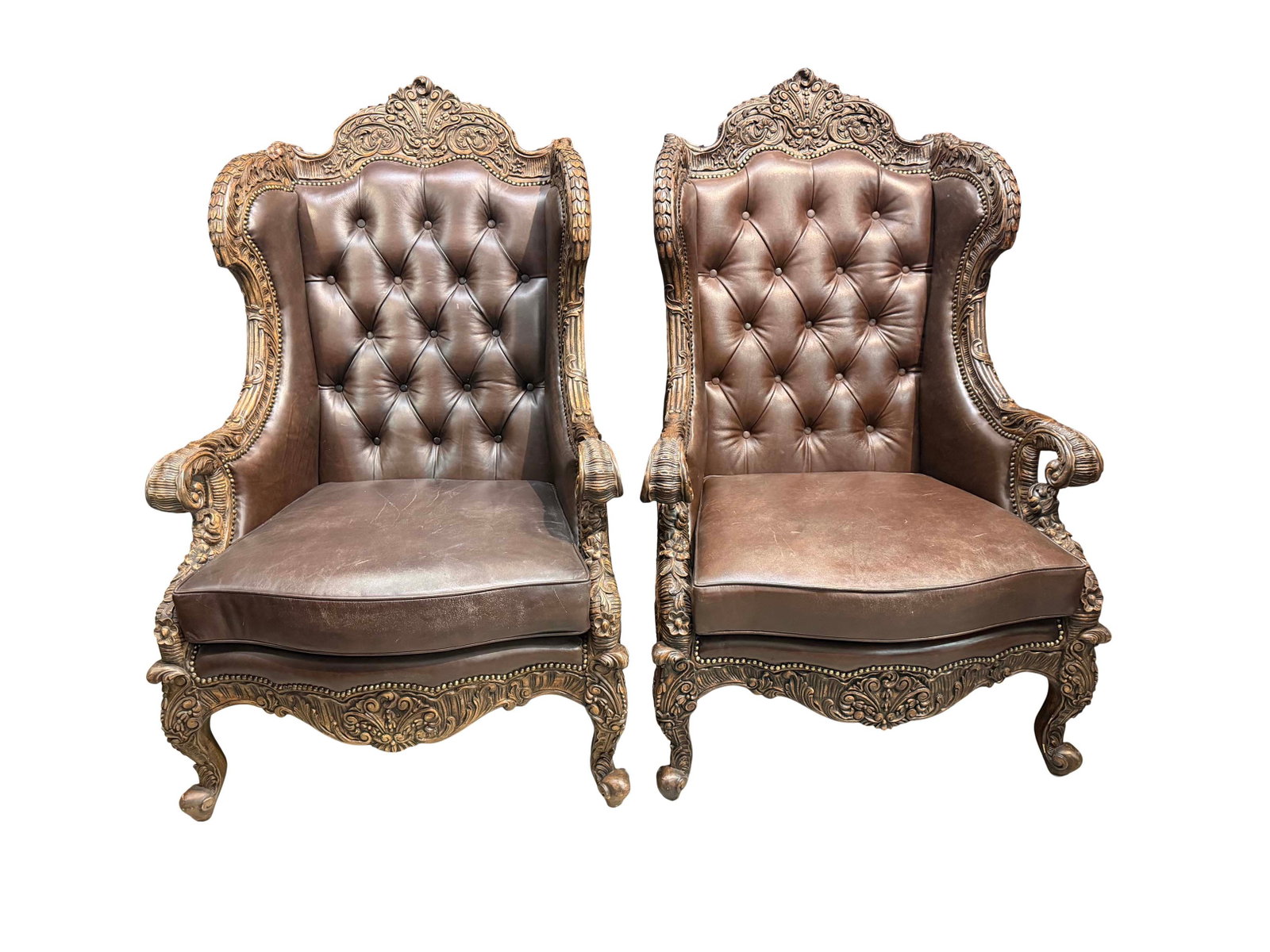 PAIR OF LARGE HEAVY CARVED WINGED BACK CHAIRS WITH BUTTON TUFTED LEATHER UPHOLSTERY 56"H X 35"W X (1 of 4)