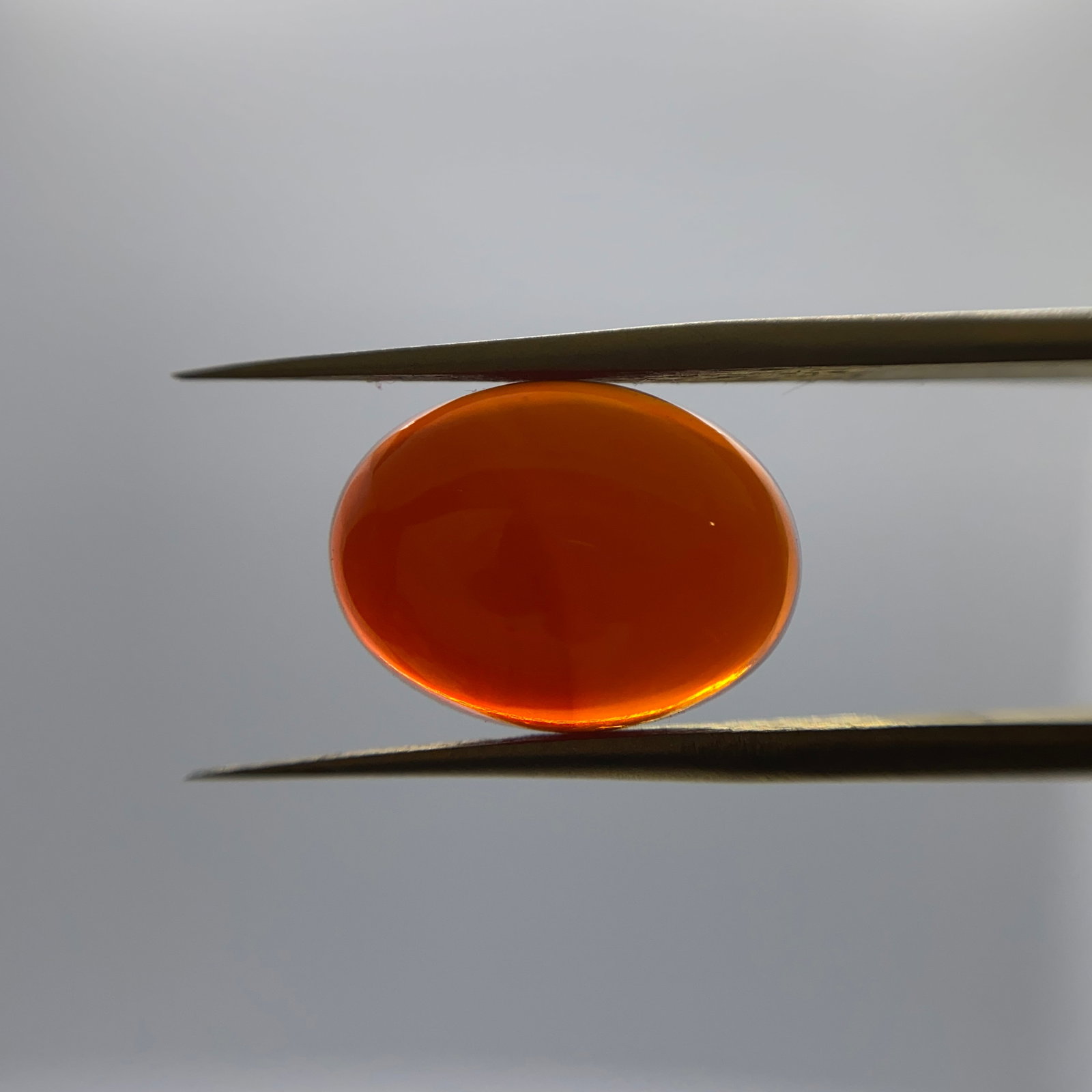 Rare Natural Fire Opal Gemstone: A striking 3.68ct natural fire opal featuring an intense primary color profile with excellent light return. Facet-grade fire opal of this intense body color is rarely found intact. Personally reviewed