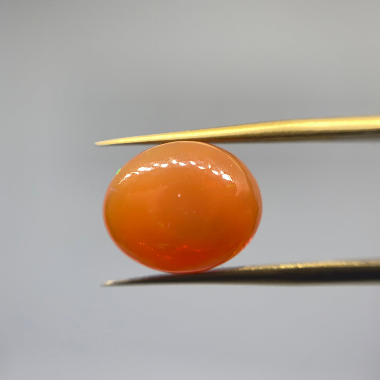 Rare Natural Fire Opal Gemstone: A beautifully faceted 3.37ct natural fire opal possessing high transparency and exceptional color depth. Exceptional color depth without crazing makes this a rare collector's gem. Personally reviewed 