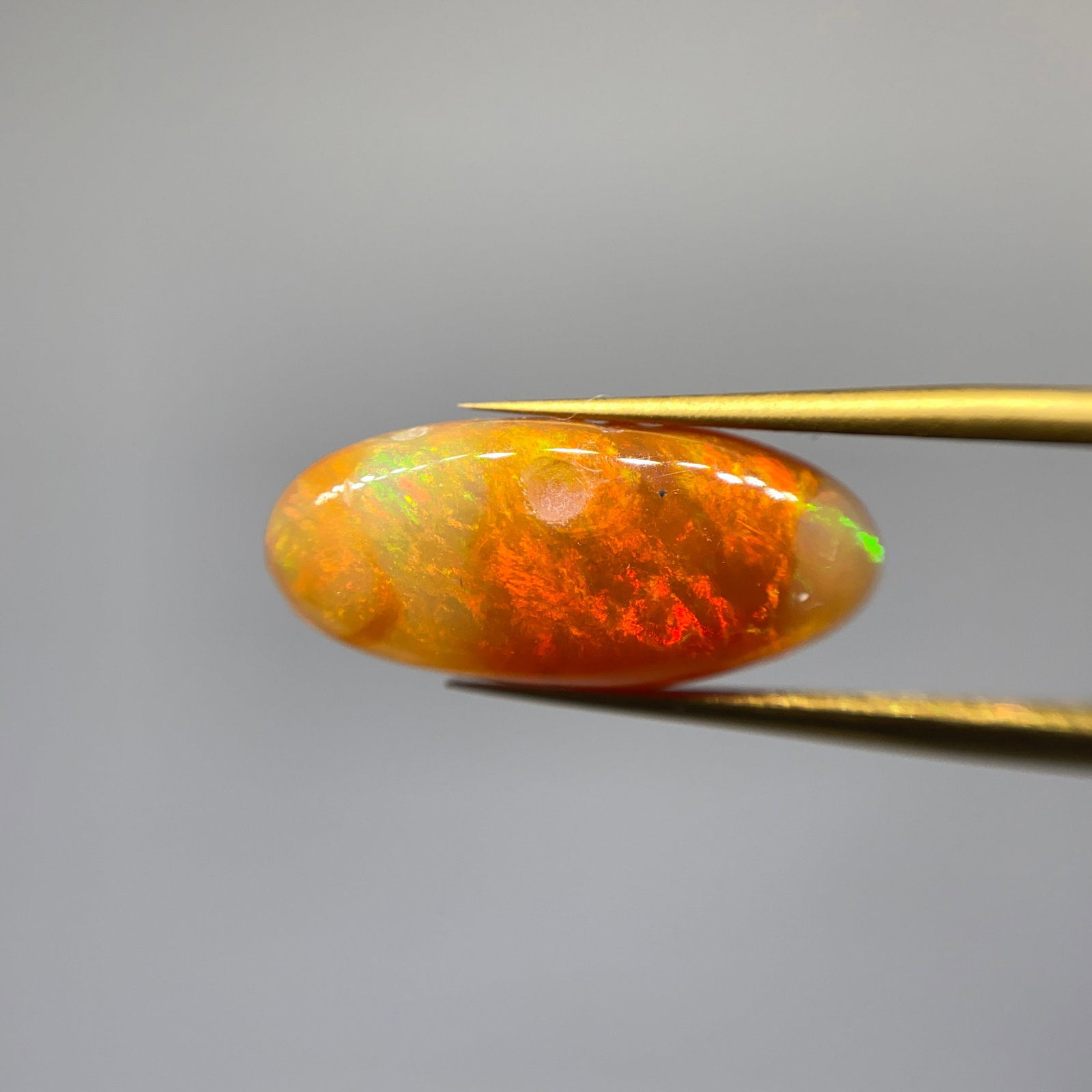 Rare Natural Fire Opal Gemstone: A fine-quality 3.03ct natural fire opal with excellent transparency and vibrant coloration perfect for bespoke jewelry. High-transparency fire opals of this caliber are increasingly difficult to sourc