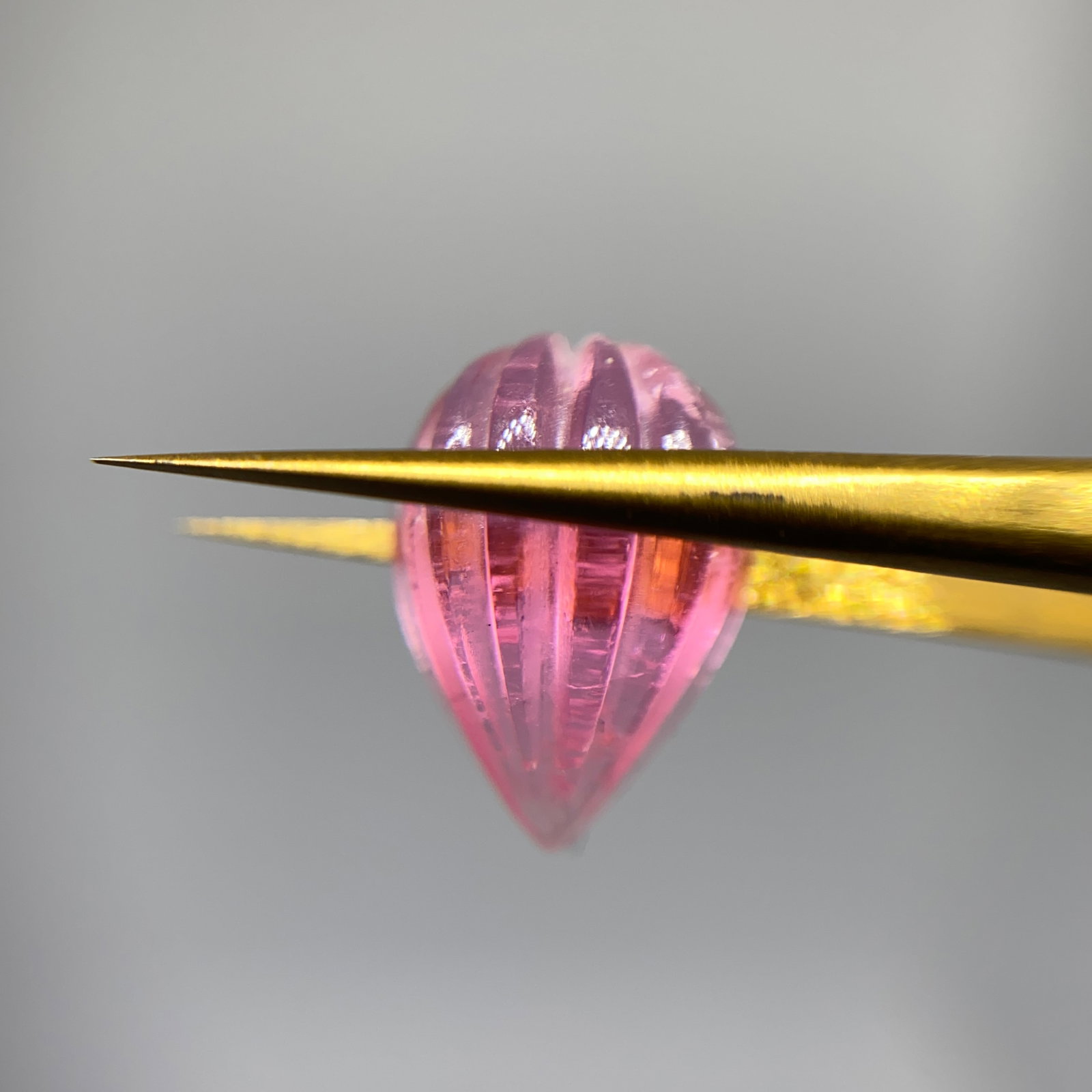 Rare Hand-Carved Pink Tourmaline Sculpture: A highly detailed 4.38ct hand-carved natural pink tourmaline featuring intricate lapidary work and deep saturation. Intricate lapidary work on gem-grade tourmaline is incredibly scarce. Personally rev