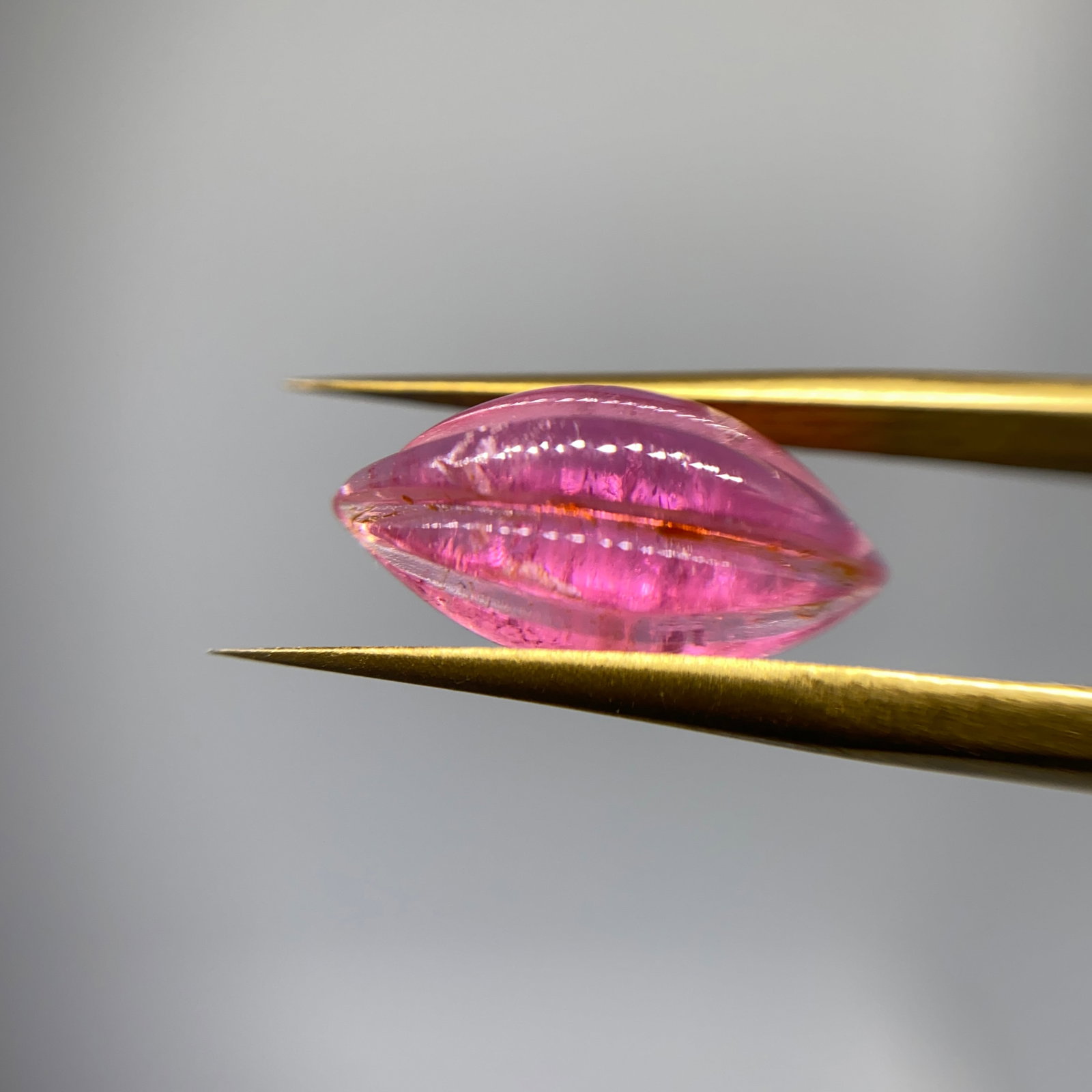 Rare Hand-Carved Pink Tourmaline Sculpture: An exquisite, dimensional 3.00ct tourmaline carving that beautifully highlights the gem's natural pink pleochroism. Carvings that perfectly capture pink pleochroism are rare masterworks. Personally re