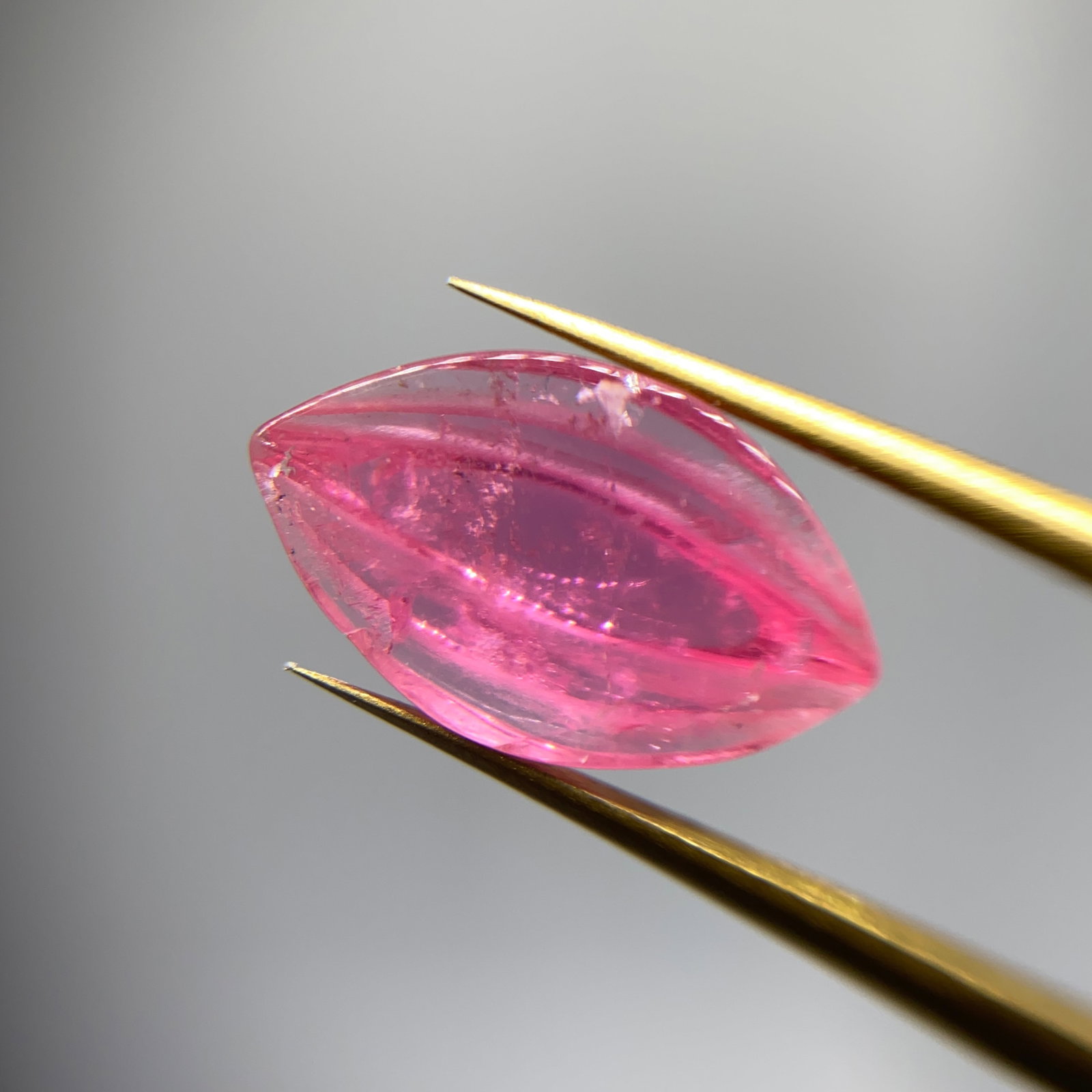 Rare Hand-Carved Pink Tourmaline Sculpture: A fine 2.37ct natural pink tourmaline gemstone artistically carved to maximize both light return and natural aesthetic appeal. Fine natural pink tourmaline is rarely committed to this level of artisti