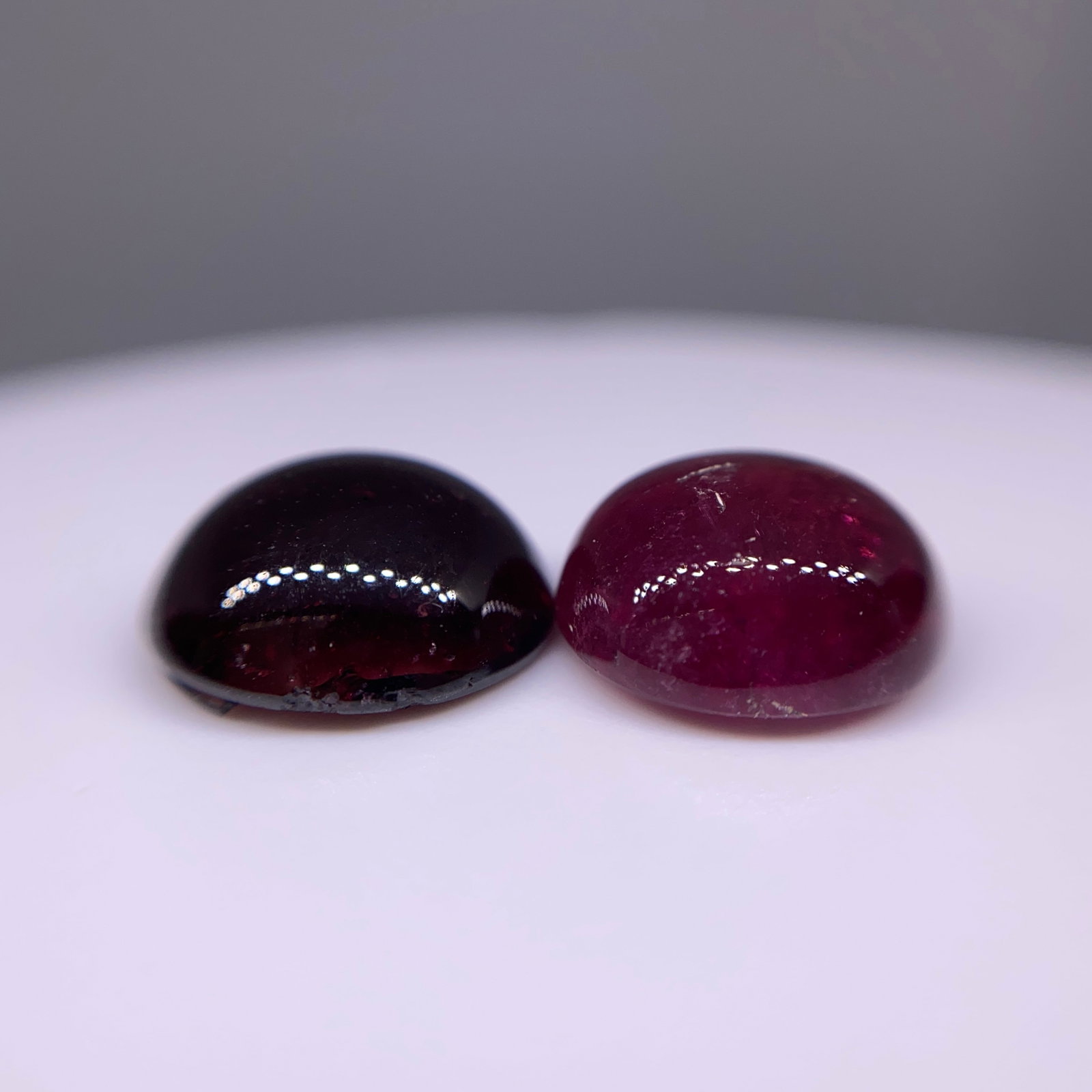 Rare Natural Garnet Cabochon Pair: An excellent 10.63ct matched pair of natural garnet cabochons, ideally suited for high-end bespoke earring settings. Matched 10+ carat garnet pairs of this high-dome quality are rarely assembled. Pers