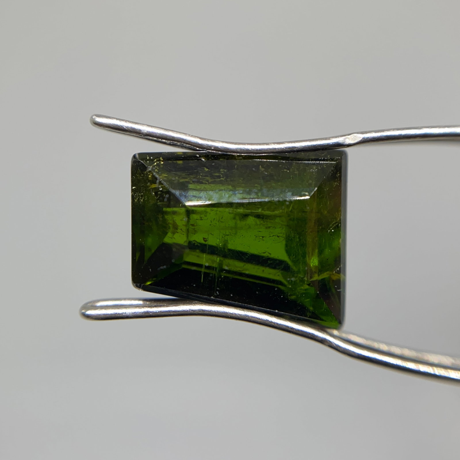 Rare Natural Green Tourmaline Gemstone: A finely faceted 4.33ct green tourmaline displaying an open, lively green color with superior clarity and brilliance. Open, lively green tourmalines with superior clarity are among the rarest in the b