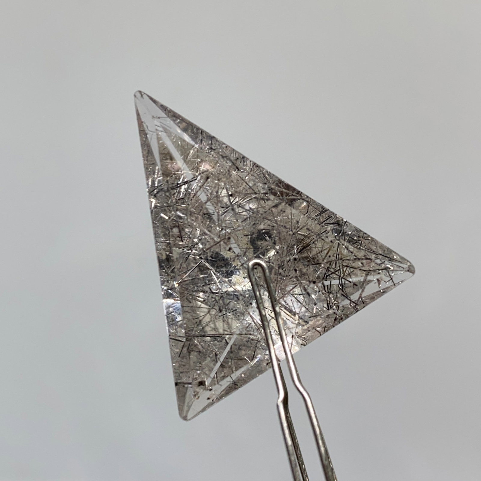 Rare Natural Triangle Quartz Crystal by Francis J. Sperisen: A large 24.79ct precision-cut triangular quartz gemstone with exceptional eye-clean clarity and high polish. Quartz precision-cut to this exceptional scale and eye-clean clarity is exceedingly rare. T