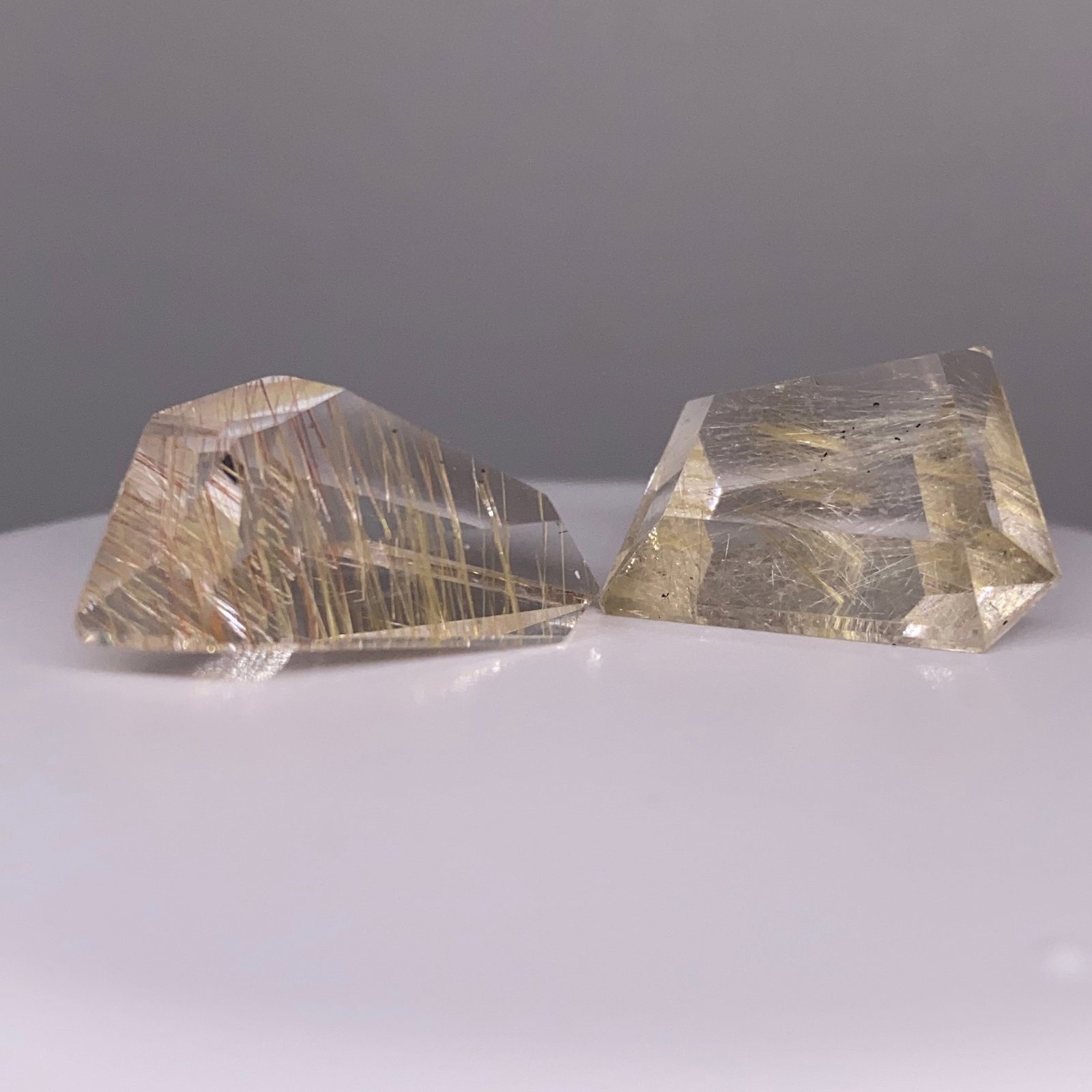 Rare Natural Quartz Crystal Pair by Francis J. Sperisen: An impressive 30.12ct pair of natural quartz gemstones boasting pristine clarity and identical matching. Identical matching of pristine 30-carat quartz gemstones is a rare lapidary feat. This piece or