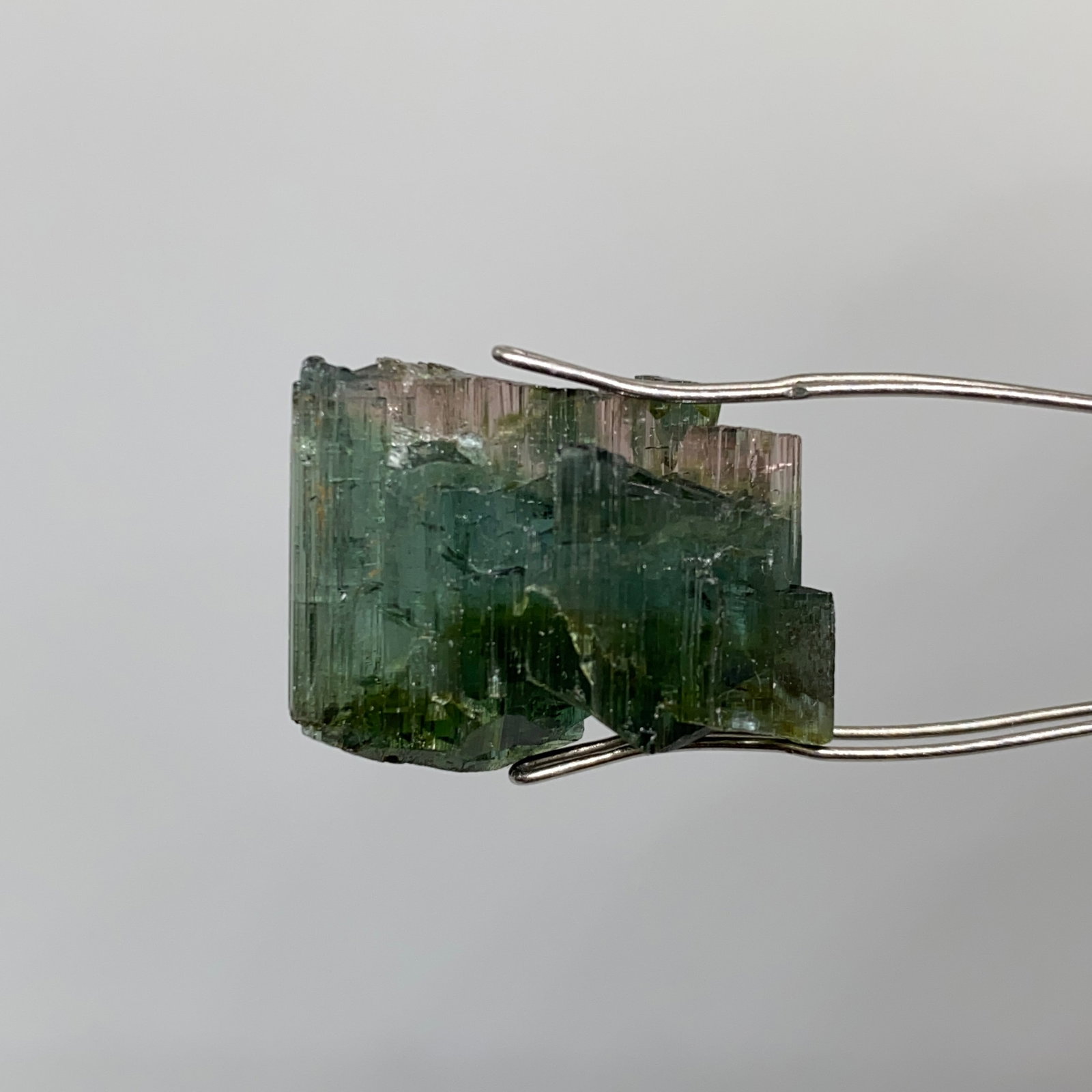 Rare Rough Tourmaline Mineral Specimen: A substantial 21.15ct unheated tourmaline rough crystal showing prominent natural striations and excellent gem potential. Substantial 21-carat unheated rough showing such excellent gem potential is in