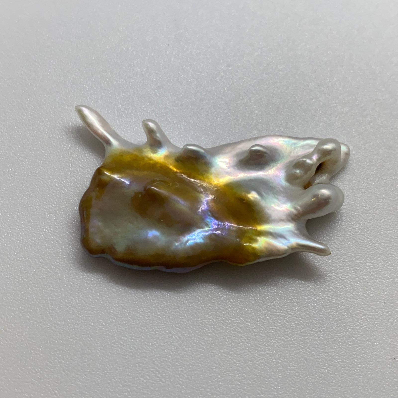 Rare Cultured Pearl Mineral Specimen: A heavy 17.20ct organically formed cultured pearl specimen showing natural contours and a bright, reflective luster. Heavy 17-carat cultured pearls showing these bright, natural contours are highly ra