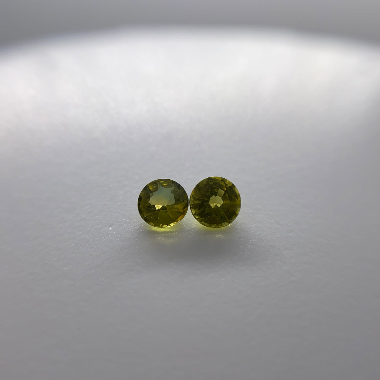 Rare Natural Green Sapphire Gemstone Pair: A nicely matched 0.78ct pair of natural green sapphires showing excellent durability and a vibrant, lively hue. Matched natural green sapphires of this lively hue are exceptionally rare to pair. Perso