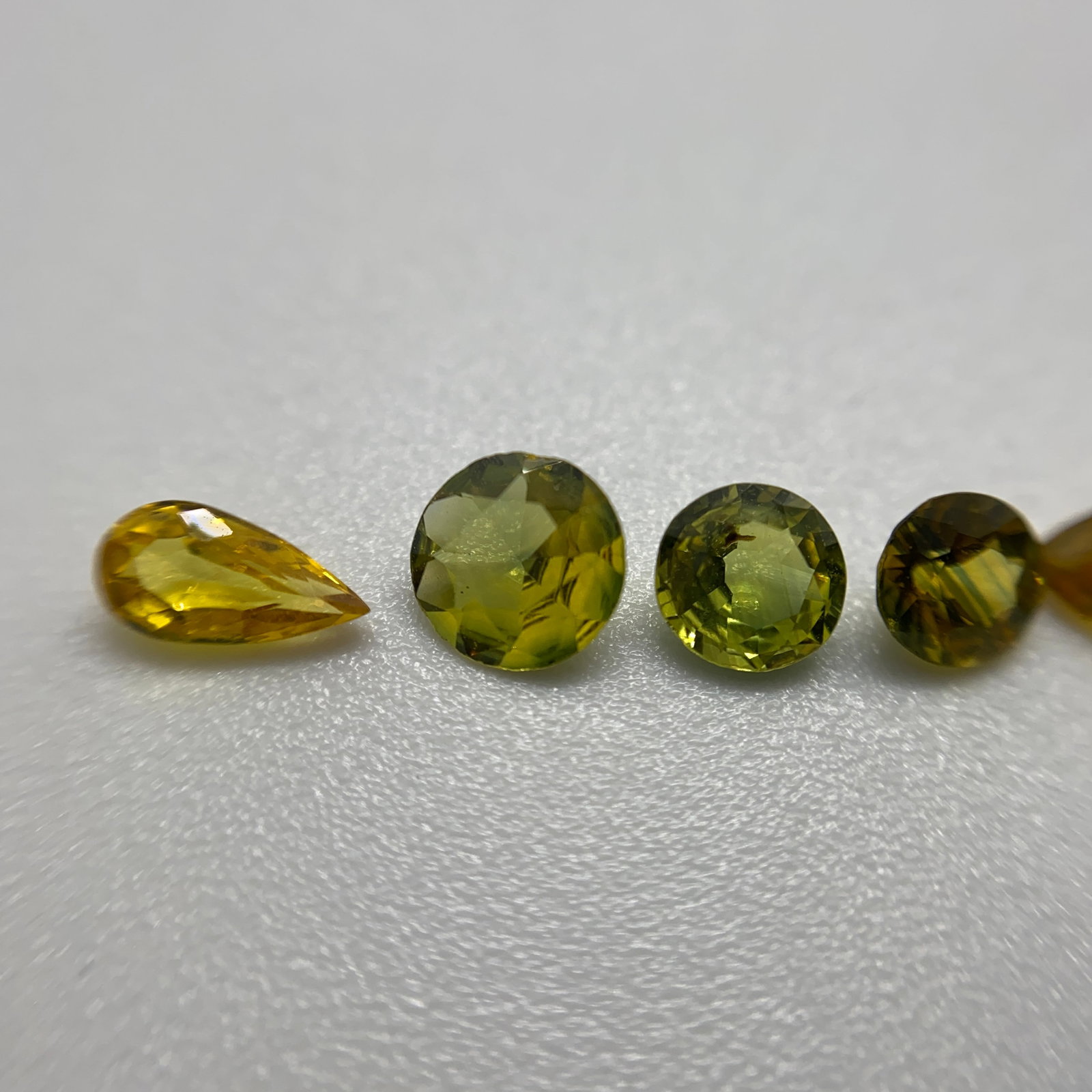 Rare Natural Yellow Sapphire Gemstone Lot: A well-matched 4.06ct parcel of vibrant, brilliant-cut yellow sapphires showing uniform sunshine hues and high clarity. Well-matched parcels of brilliant-cut yellow sapphires showing uniform high clar
