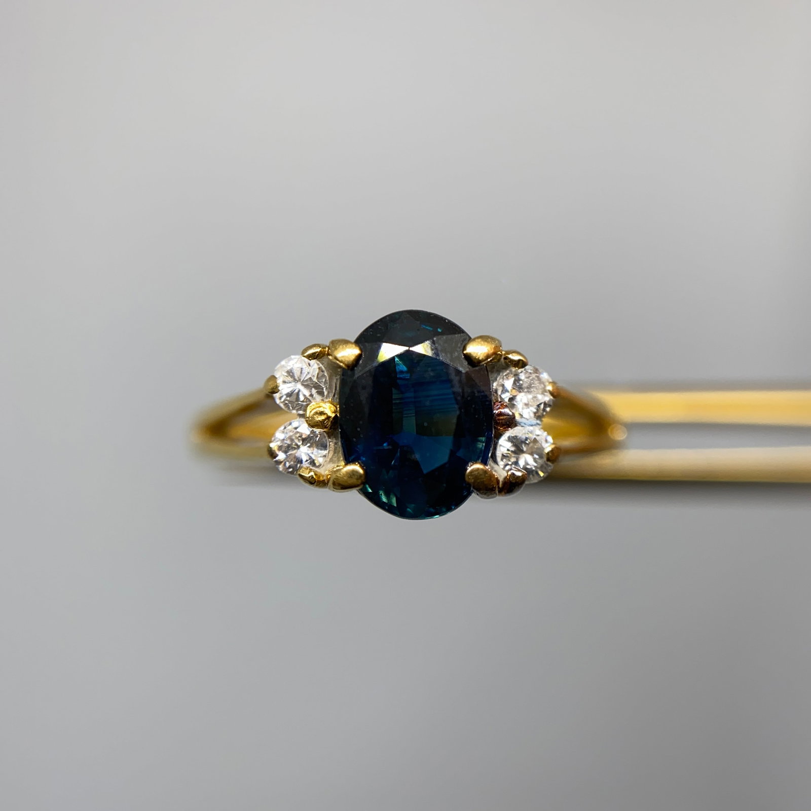 Heirloom 18K Gold Sapphire & Diamond Ring Size 5.25: A premium 2.75g 18K gold ring featuring a velvety blue sapphire surrounded by a brilliant, high-clarity diamond halo. Velvety blue sapphires surrounded by high-clarity diamond halos are rare, highly s