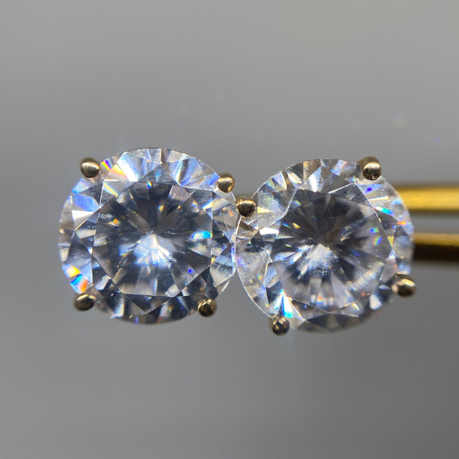 Heirloom 14K Gold Diamond Simulant Stud Earrings: A classic 1.84g pair of 14K gold stud earrings set with highly refractive diamond simulants that offer exceptional, flawless sparkle. Highly refractive diamond simulants offering this flawless, except