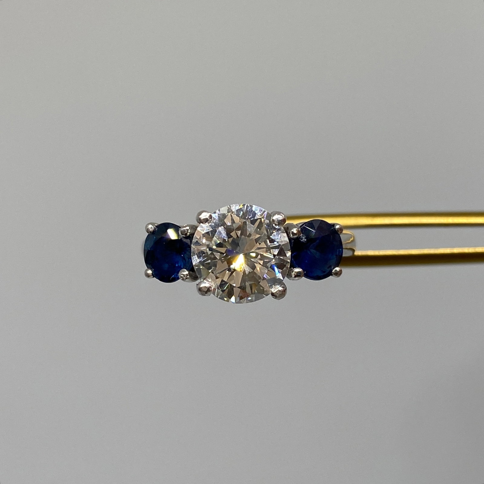 Heirloom Platinum GIA Certified 1.87ct Diamond & Sapphire Engagement Ring: A spectacular 6.04g heavy platinum engagement ring featuring a 1.87ct VS GIA-certified diamond center stone flanked by high-quality natural sapphires. Heavy platinum engagement rings featuring GIA-cer