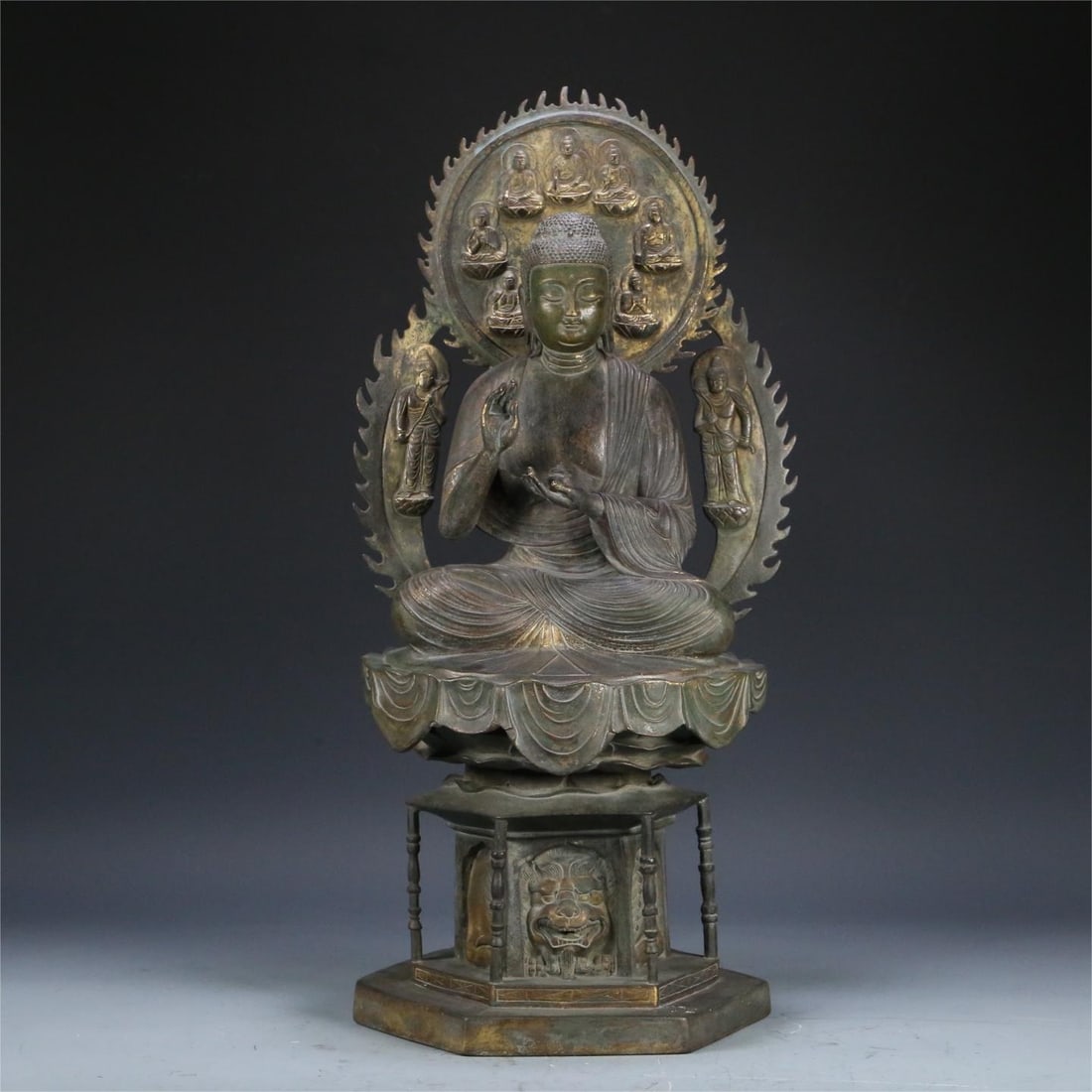 A bronze gilt statue of the Medicine Buddha of the Tang Dynasty: Tang Dynasty bronze gilt Medicine Buddha statue Size:55x27x24cm W:12.75kg (The Dimensions Of All Batches Are Manually Measured.If You Need More Detailed Information, Please Contact Our Customer Servic