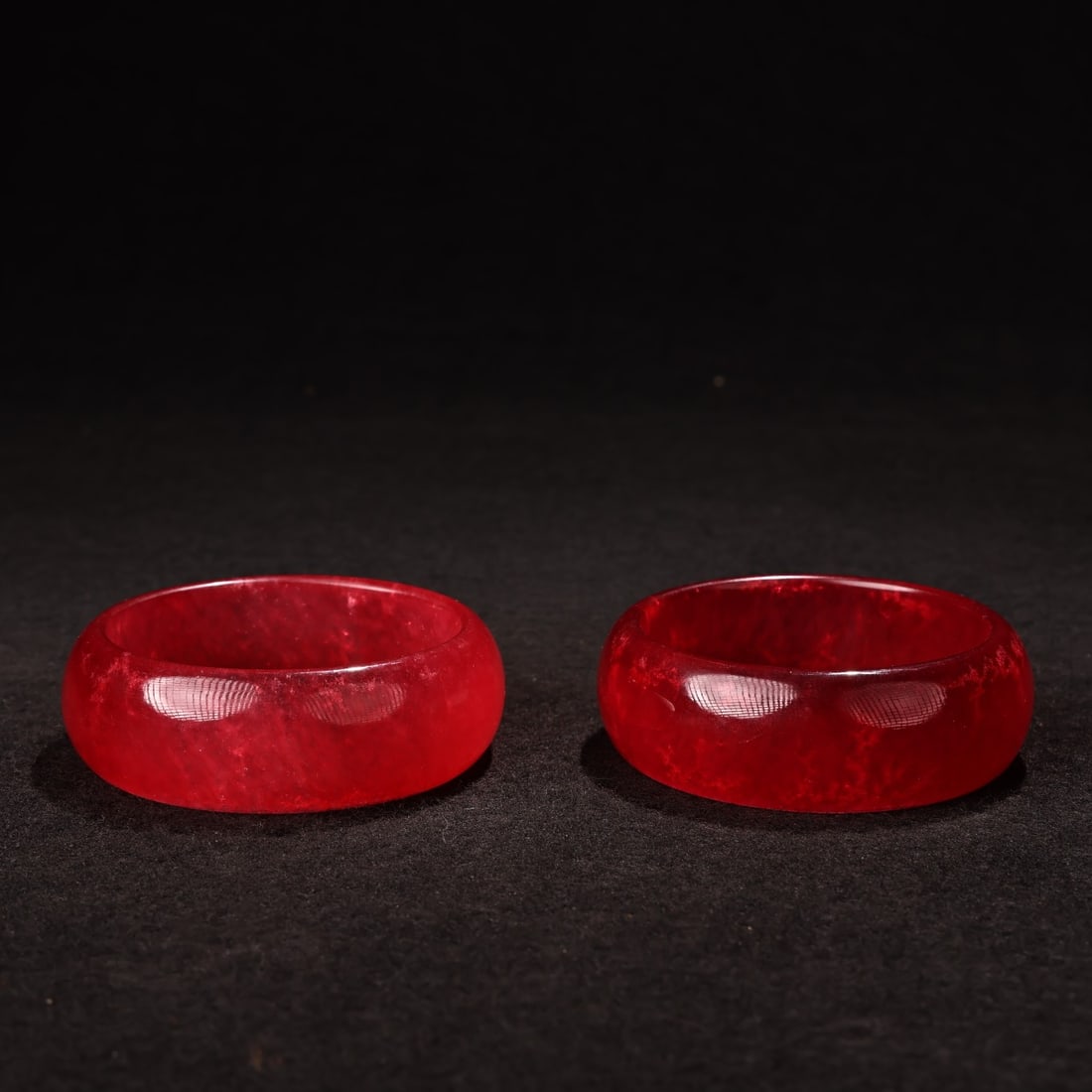 A pair of Qing Dynasty high ice red jade bracelets: Qing Dynasty high ice red jade bracelet Size:Box L:29cm W:17cm D:12cm Bracelet W:0.1kg lnside diameter:6cm W:2.5cm (The Dimensions Of All Batches Are Manually Measured.If You Need More Detailed Inform