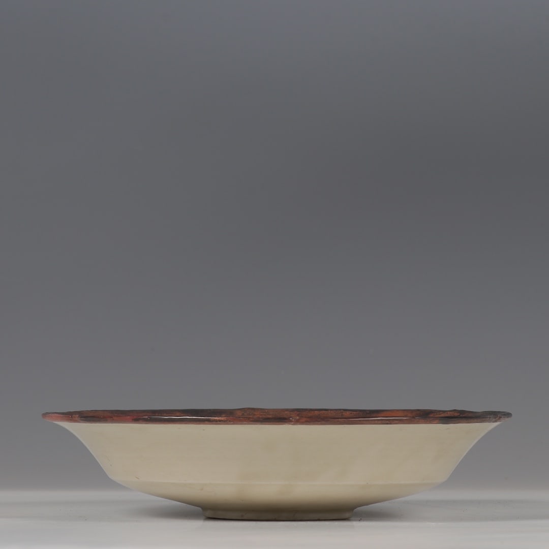 A copper mouth carved flower plate from the Song Dynasty Ding kiln: The copper mouth carved flower plate of the Song Dynasty Ding kiln Size:H:4.5cm D:20.5cm (The Dimensions Of All Batches Are Manually Measured.If You Need More Detailed Information, Please Contact Our 