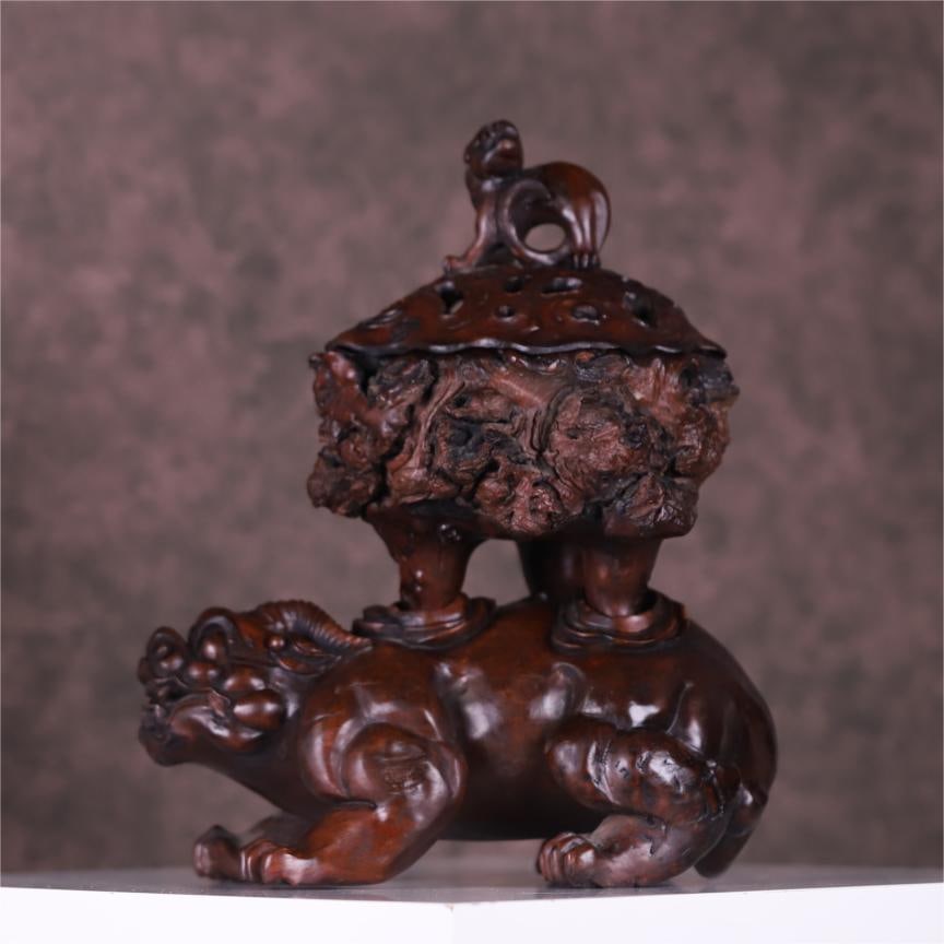 A Qing Dynasty mahogany carved auspicious beast support gall wood aroma burner (1 of 10)