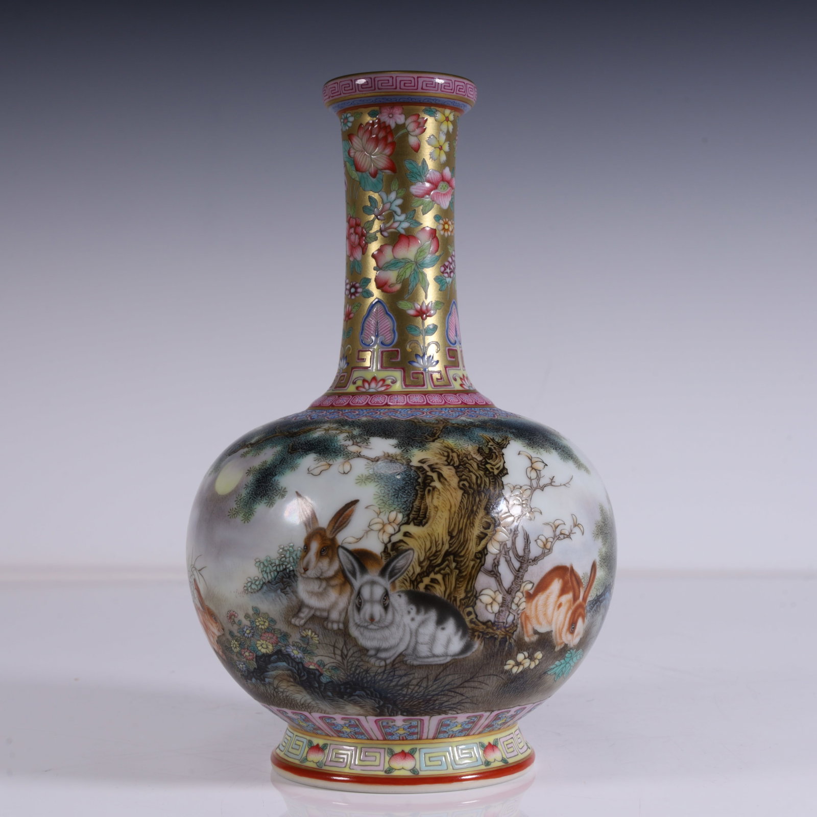 A rabbit viewing vase made in the Qing Dynasty Longqian year with a golden background pattern edge: Qing Dynasty Longqian year Jindi miscellaneous flower pattern edge rabbit scenery vase SIZE: L: 12.5cm H:19cm W:480g (The Dimensions Of All Batches Are Manually Measured.If You Need More Detailed Info