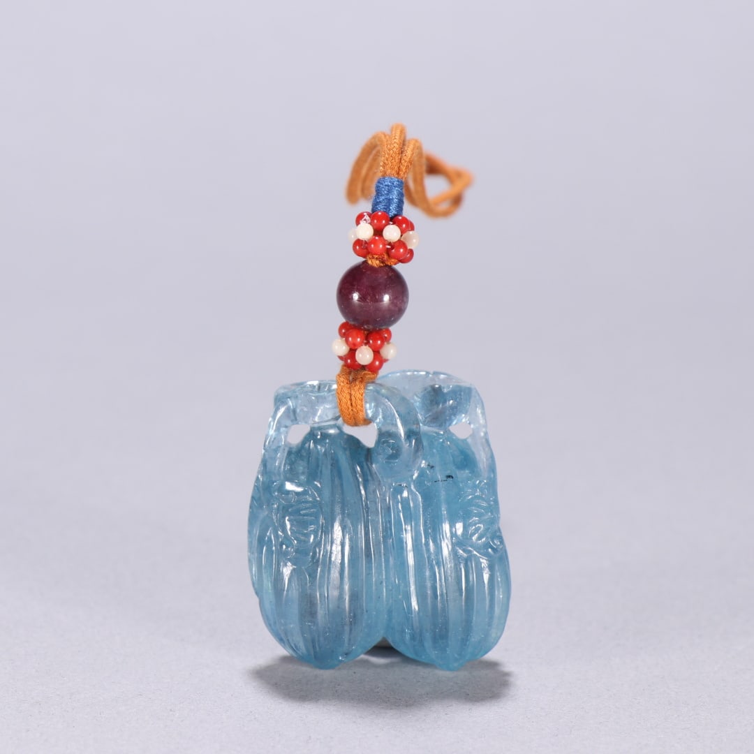 A Qing Dynasty aquamarine treasure blessing melon pendant (1 of 9)