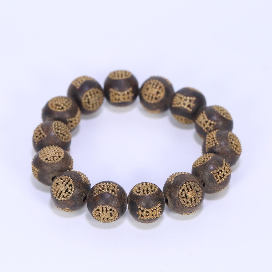 An old agarwood inlaid silver gilt longevity pattern bracelet from the Qing Dynasty (1 of 8)