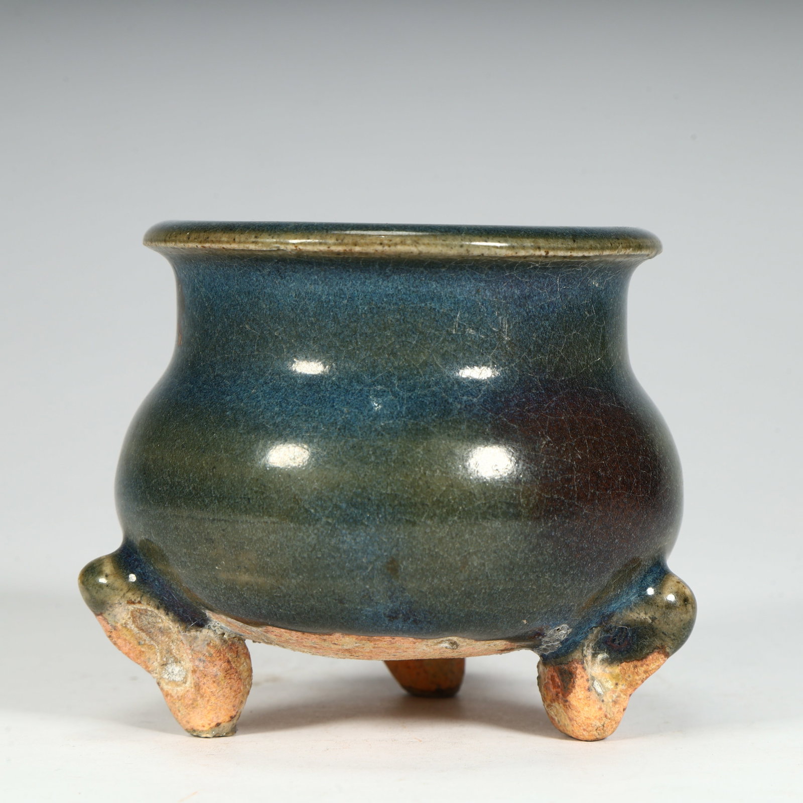 A three-legged furnace with sky blue glazed purple spots from the Jun kiln in the Ming Dynasty (1 of 8)