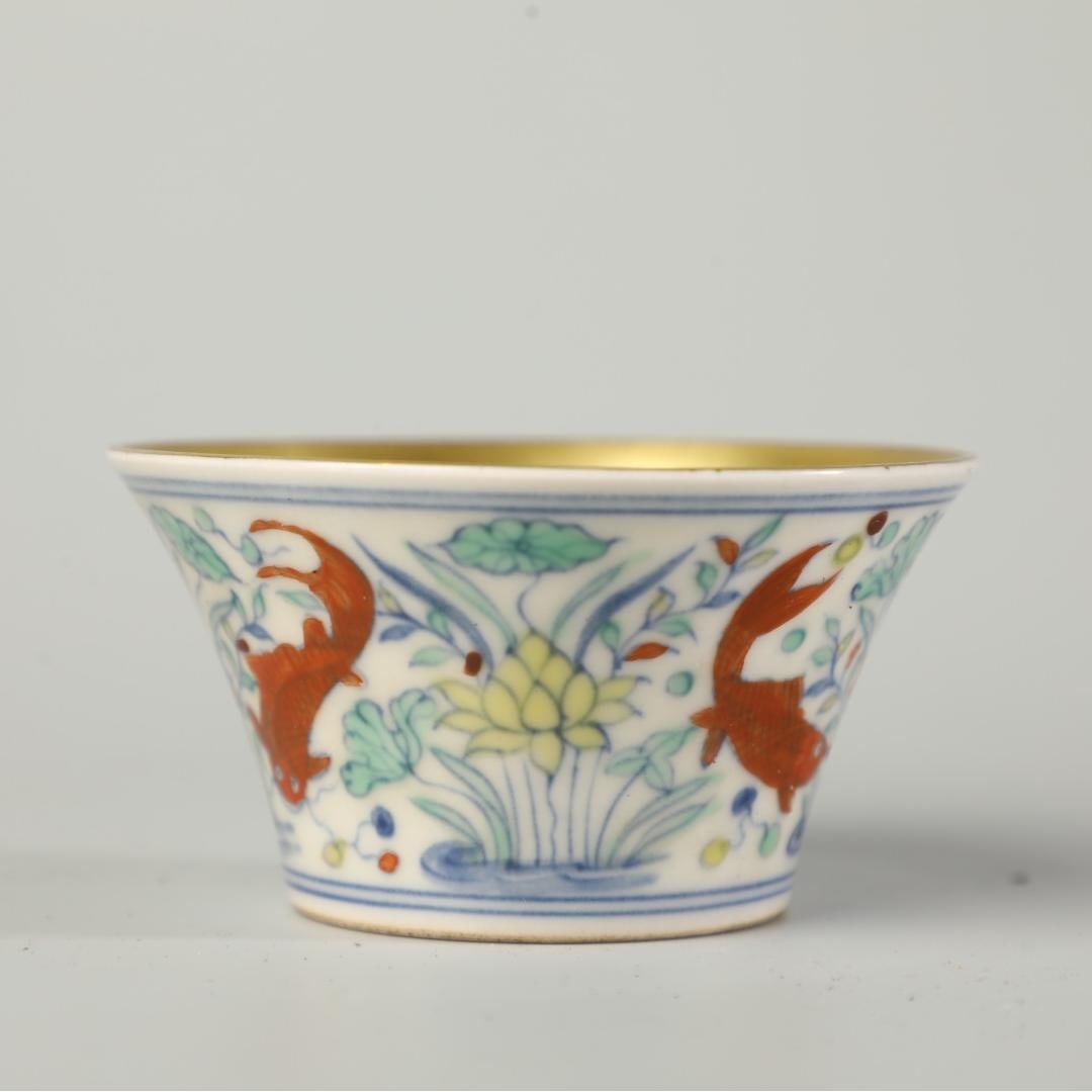 A Doucai cup made in the Chenghua year of the Ming Dynasty: The Doucai cup of the Ming Dynasty Chenghua year Size:H:4cm D:8cm (The Dimensions Of All Batches Are Manually Measured.If You Need More Detailed Information, Please Contact Our Customer Service Before