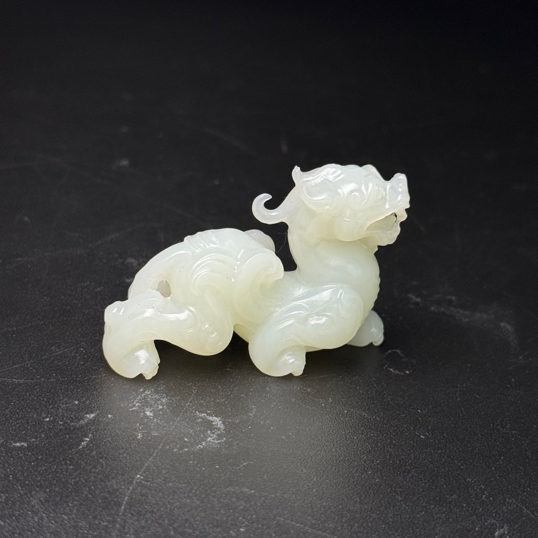 A beautiful Hetian jade auspicious beast Pixiu: Exquisite Hetian jade auspicious beast Pixiu Size:52x35x17mm W:0.033kg (The Dimensions Of All Batches Are Manually Measured.If You Need More Detailed Information, Please Contact Our Customer Service B