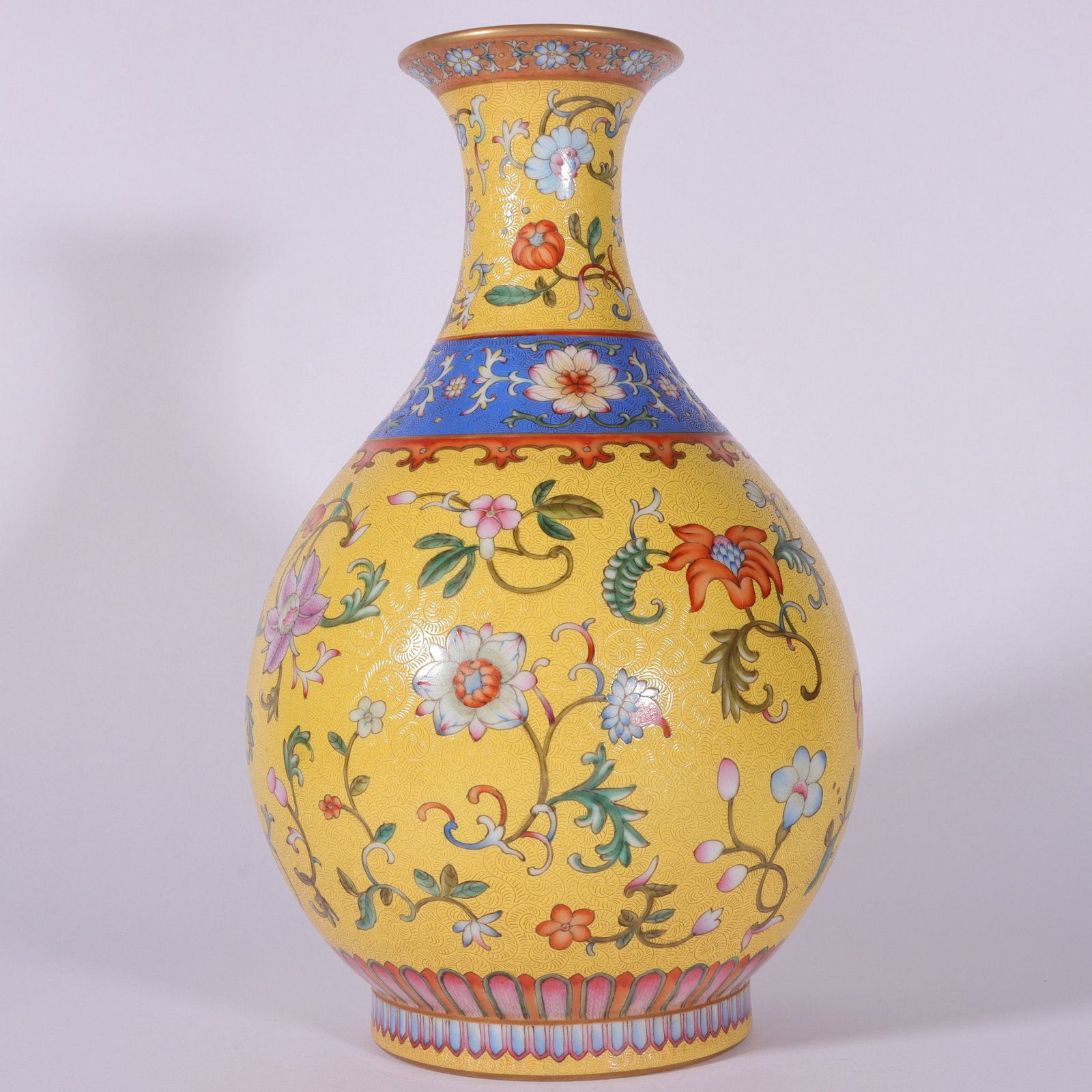A pastel yellow ground rolling road entwined lotus jade pot spring vase of the Qing Dynasty (1 of 8)
