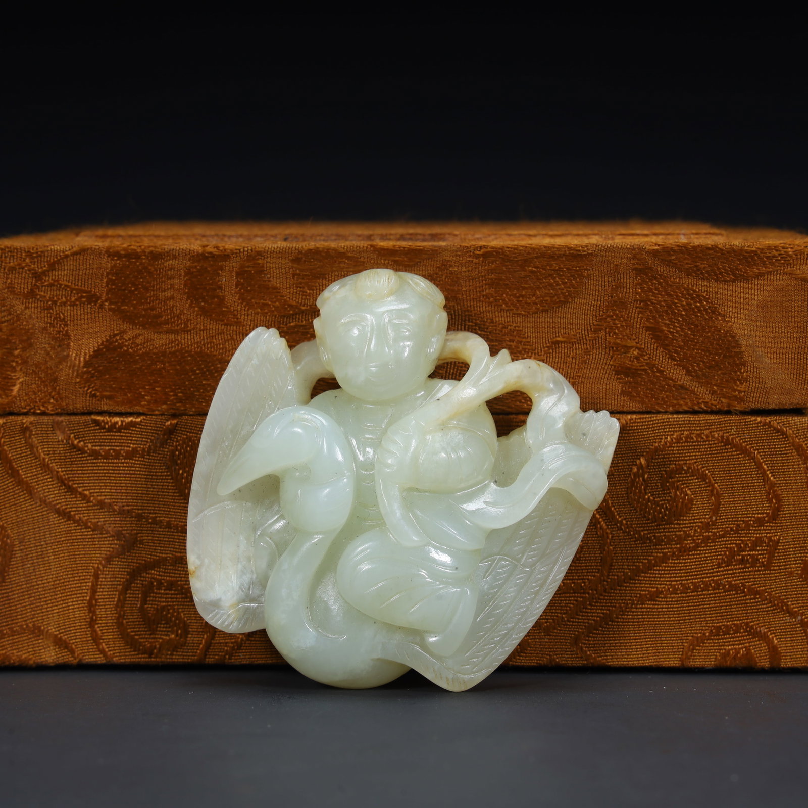 A Qing Dynasty Hetian green and white jade boy driving a crane ornament: The Qing Dynasty's Hetian green and white jade boy rides a crane ornament Size:H:5cmxL:5cmxW:2cm W: 0.0498kg (The Dimensions Of All Batches Are Manually Measured.If You Need More Detailed