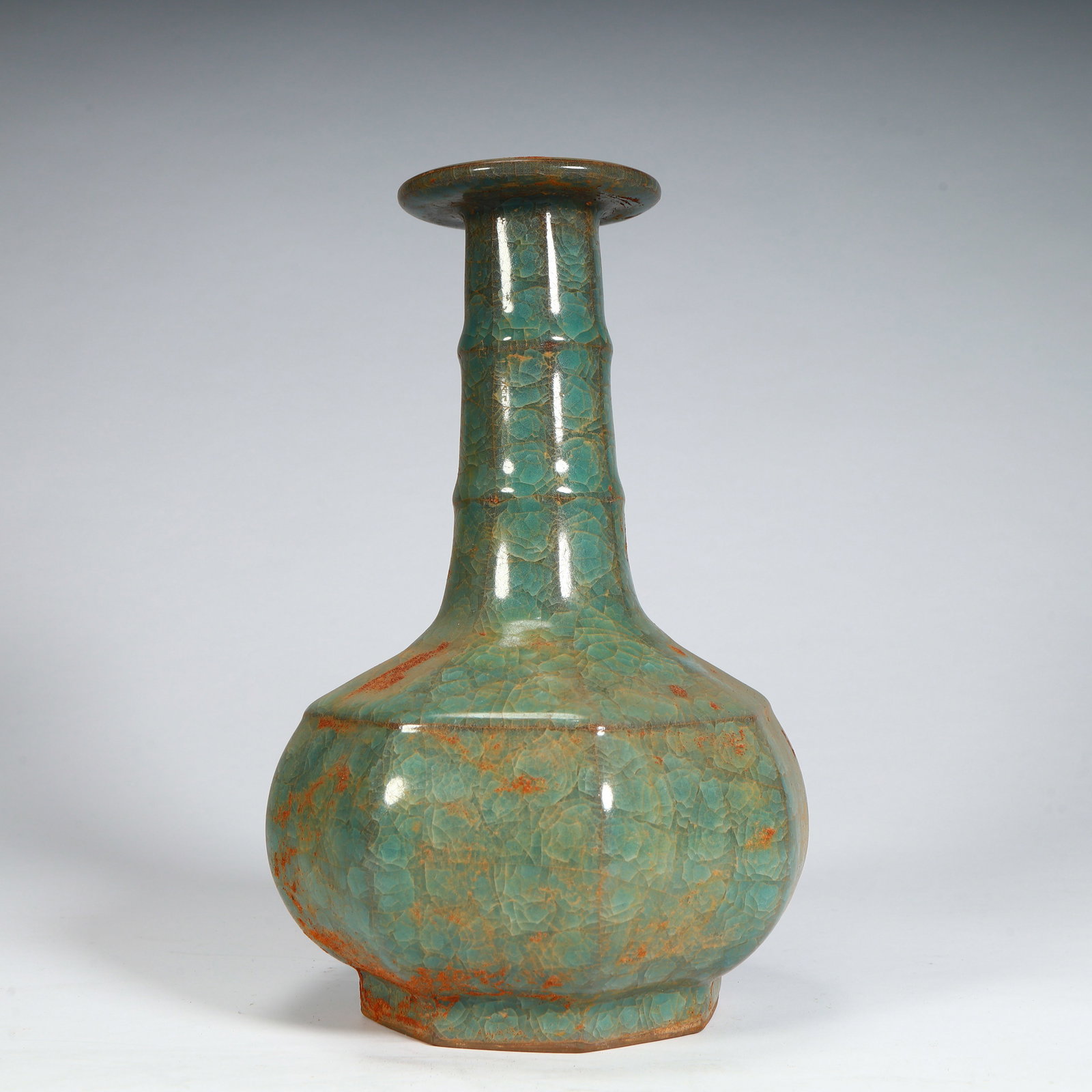 An ice-cracked celadon string pattern eight-sided long-necked bottle from the official kiln of the (1 of 9)
