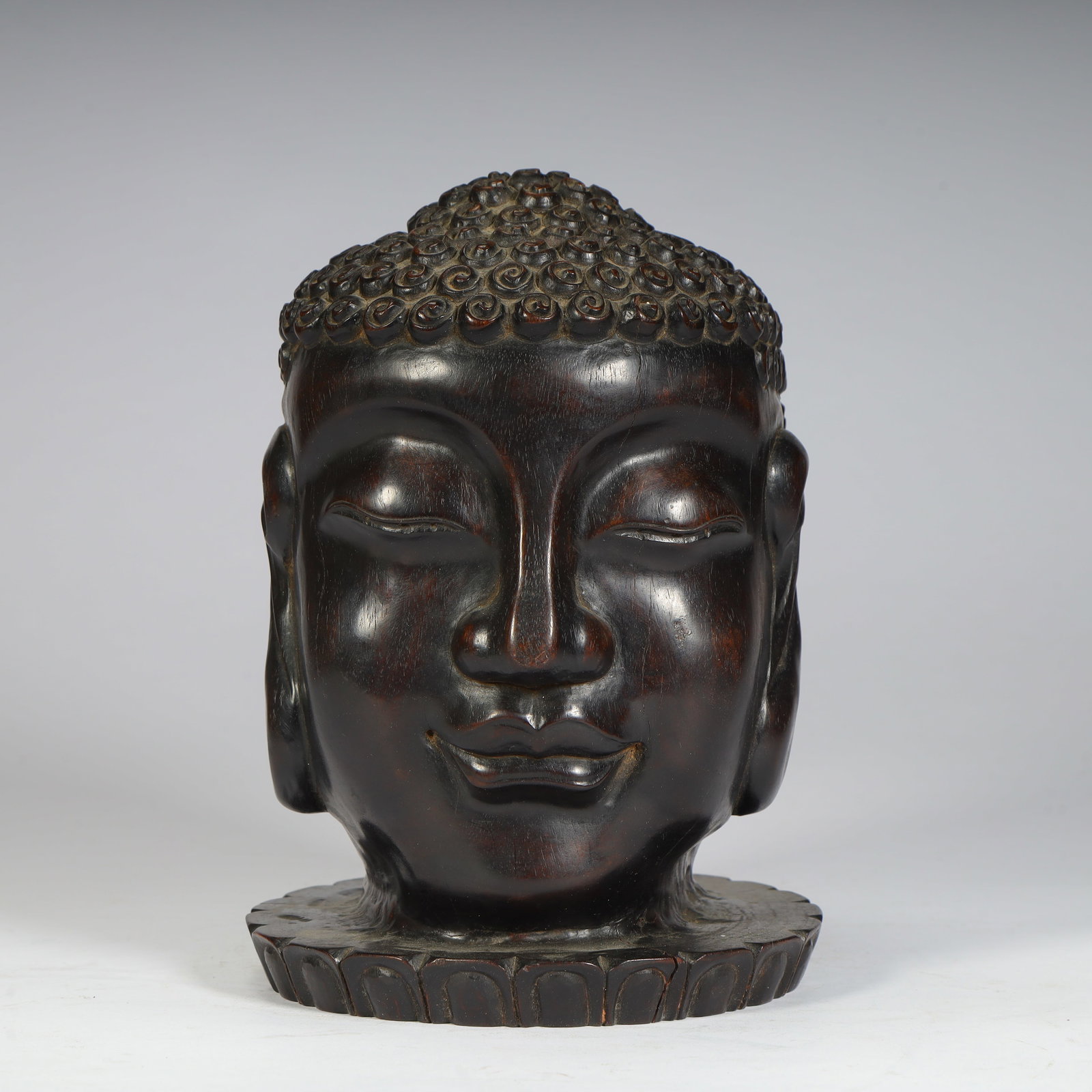 A Qing Dynasty rosewood carved Shakyamuni Buddha's head (1 of 10)