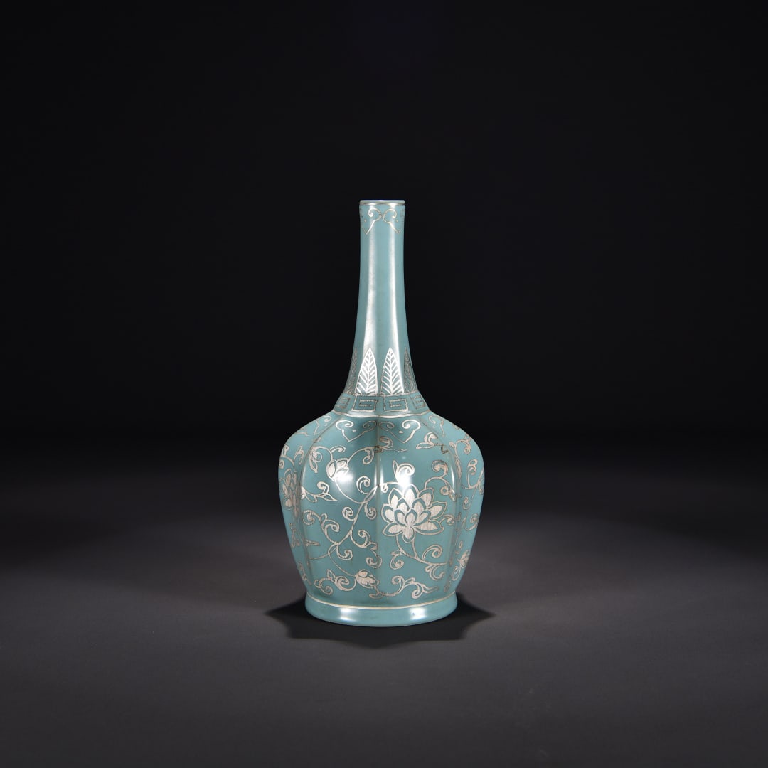 A Song Dynasty Ru kiln azure glazed foot silver painted entwined flower pattern melon gall gall: The azure glazed foot silver painted entwined flower pattern melon gall bottle of the Ru kiln in the Song Dynasty Size:H:24cm W:12cm (The Dimensions Of All Batches Are Manually Measured.If You Need Mo