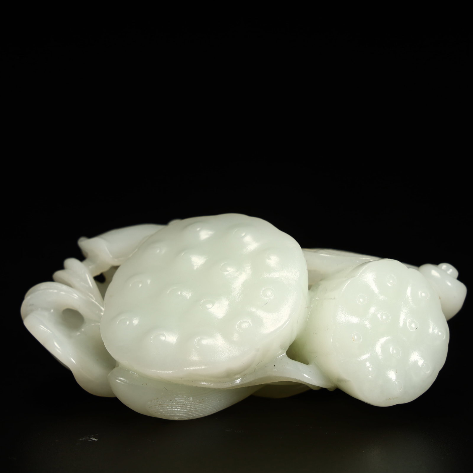 A Qing Dynasty Hetian jade lotus ornament: Qing Dynasty Hetian jade lotus pod ornament Size:H:4.5cmxL:10cmxW:6cm W: 0.204kg (The Dimensions Of All Batches Are Manually Measured.If You Need More Detailed Information, Please Contact Our Customer