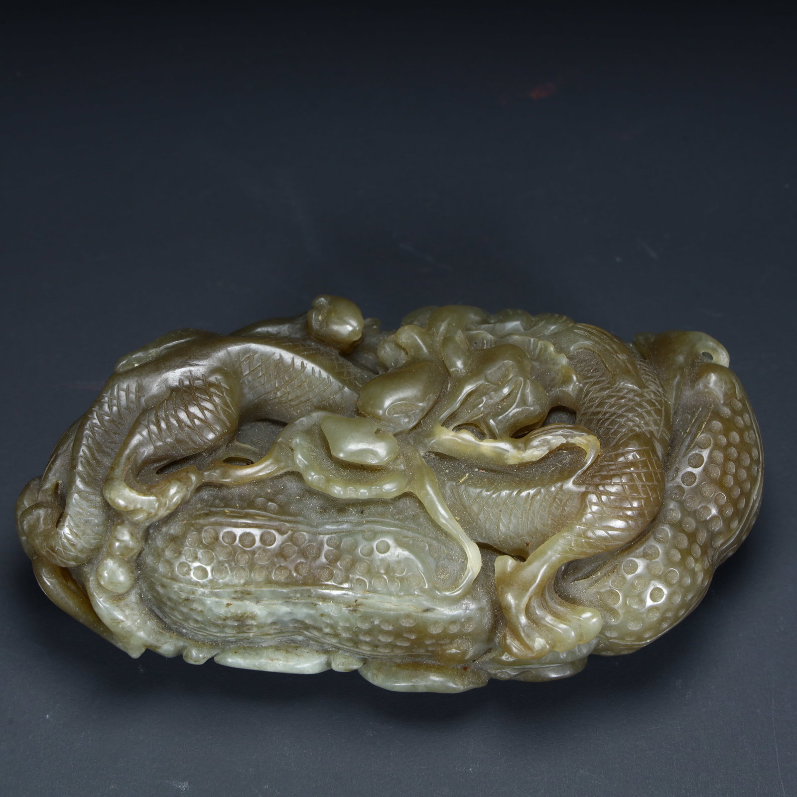 A Qing Dynasty Hetian jade beast ornament: Qing Dynasty Hetian jade auspicious beast ornament Size:H:3cmxL:10cmxW:5.5cm W: 0.275kg (The Dimensions Of All Batches Are Manually Measured.If You Need More Detailed Information, Please Contact Our C