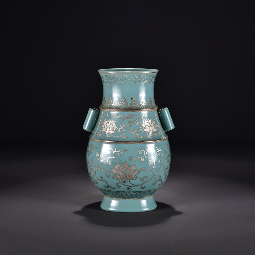 A sky-blue glazed foot silver painted entwined floral pattern amphora from the Ru kiln in the Song: Song Dynasty Ru kiln azure glazed foot silver painted entwined flower pattern amphora Size:H:23cm W:14cm (The Dimensions Of All Batches Are Manually Measured.If You Need More Detailed Information,