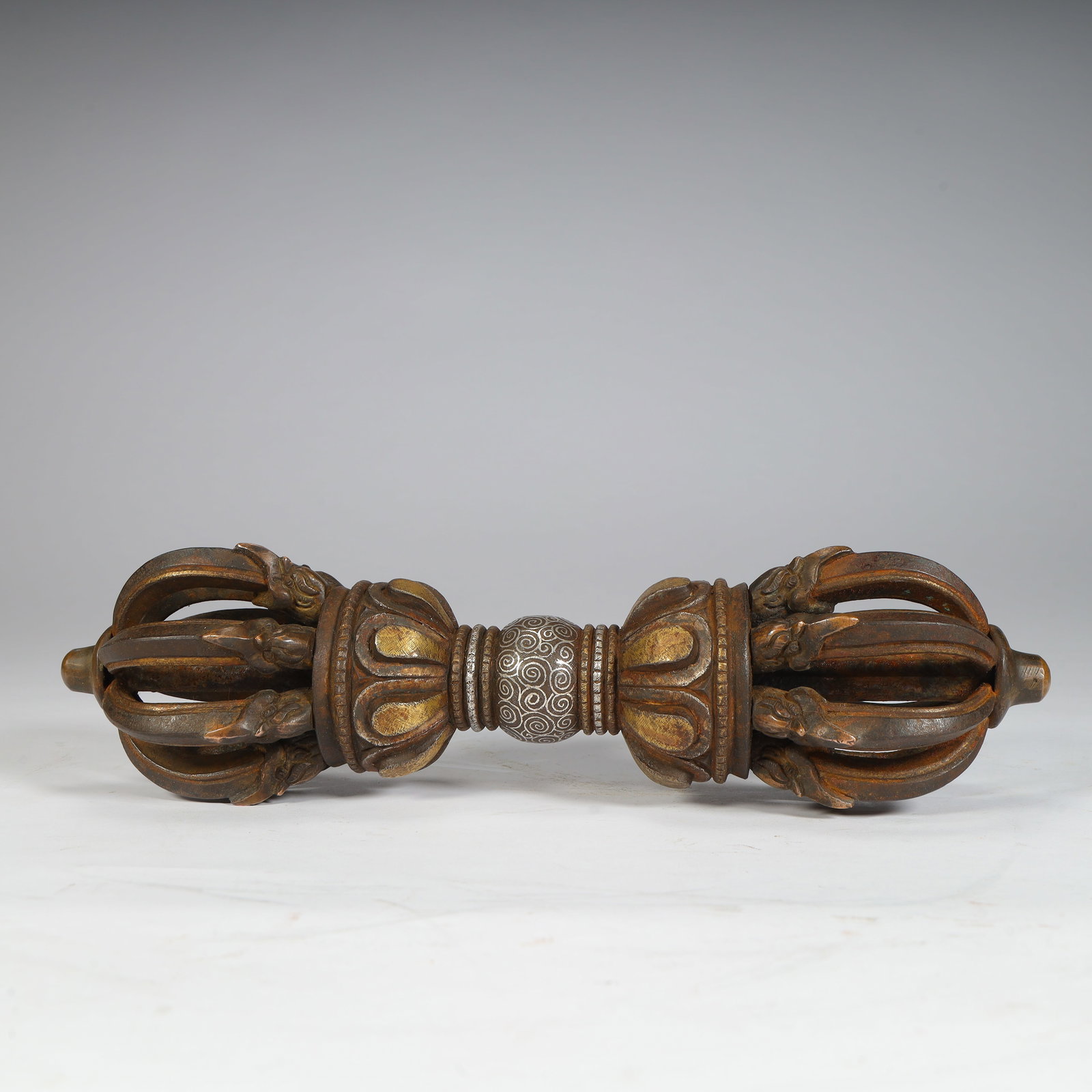 A copper-gilt silver nine-strand vajra from the Ming Dynasty: The copper gilt of the Ming Dynasty is a nine-strand vajra pestle Size:H:7cmxL:28cmxW:7cm W: 2.2kg (The Dimensions Of All Batches Are Manually Measured.If You Need More Detailed Information, Please