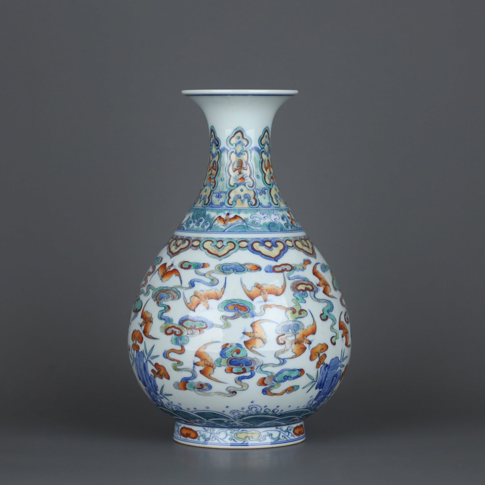 A Qing Dynasty Qianlong era made of azure glaze carved Kuilong pattern elephant ear octagonal bottle (1 of 9)